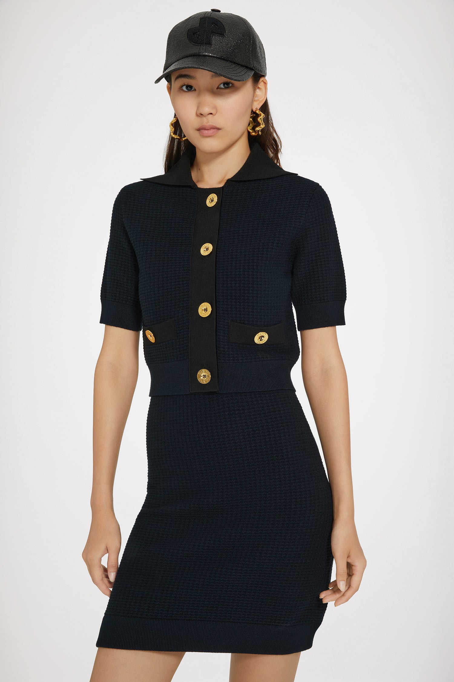 Patou - Button jacket in 3D knit - Navy - Patou revisits a Parisian classic.Navy knit jacket. Textured 3D stitch. Round neck. Ribbed collar, cuffs and hem. Short sleeves. Tonal JP embroidery at the front.This style is cropped.