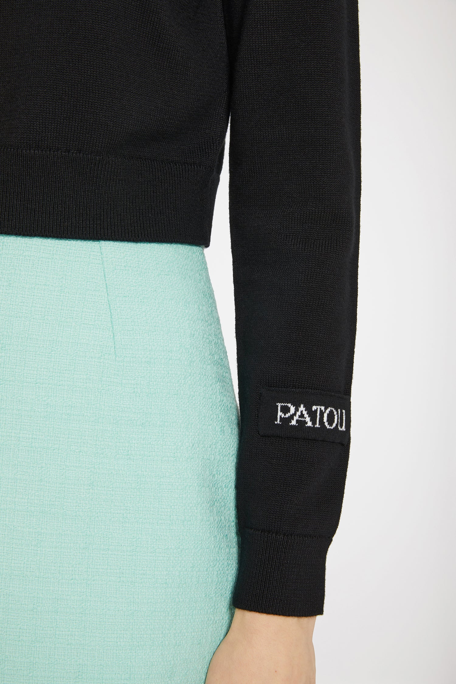 Patou - Contrast collar jumper in cotton and wool - Black - A subtler take on colour blocking.Black cotton and wool jumper. Cropped length. Round neck. Two-tone contrast collar. Patou jacquard label on the left sleeve.