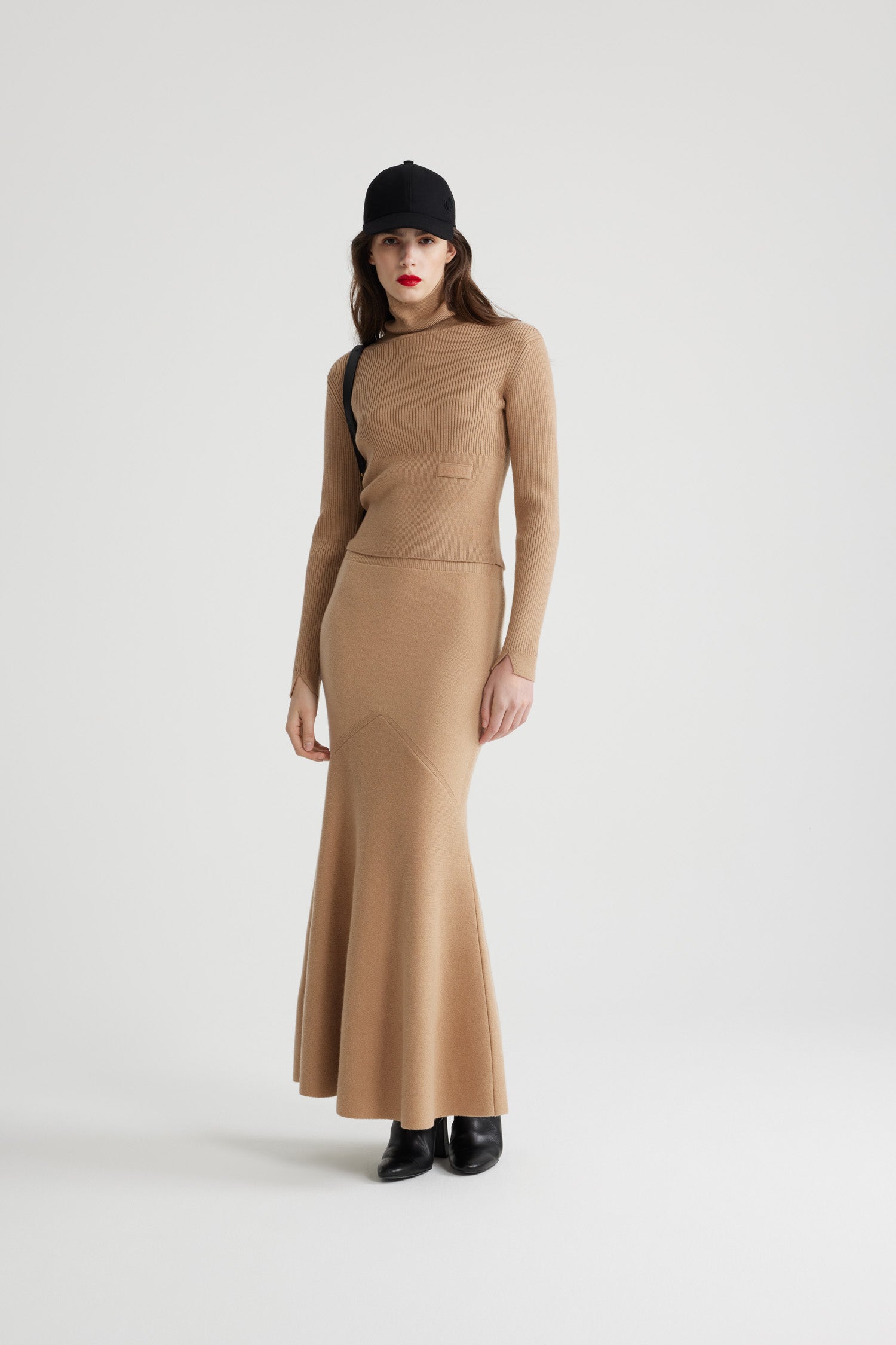Patou - Ribbed turtleneck jumper in sustainable wool and cashmere - Biscuit - Biscuit beige sustainable wool and cashmere jumper. Mixed ribs. Turtleneck. Patou jacquard label at the front. V cut-out at the cuffs.This style is fitted.