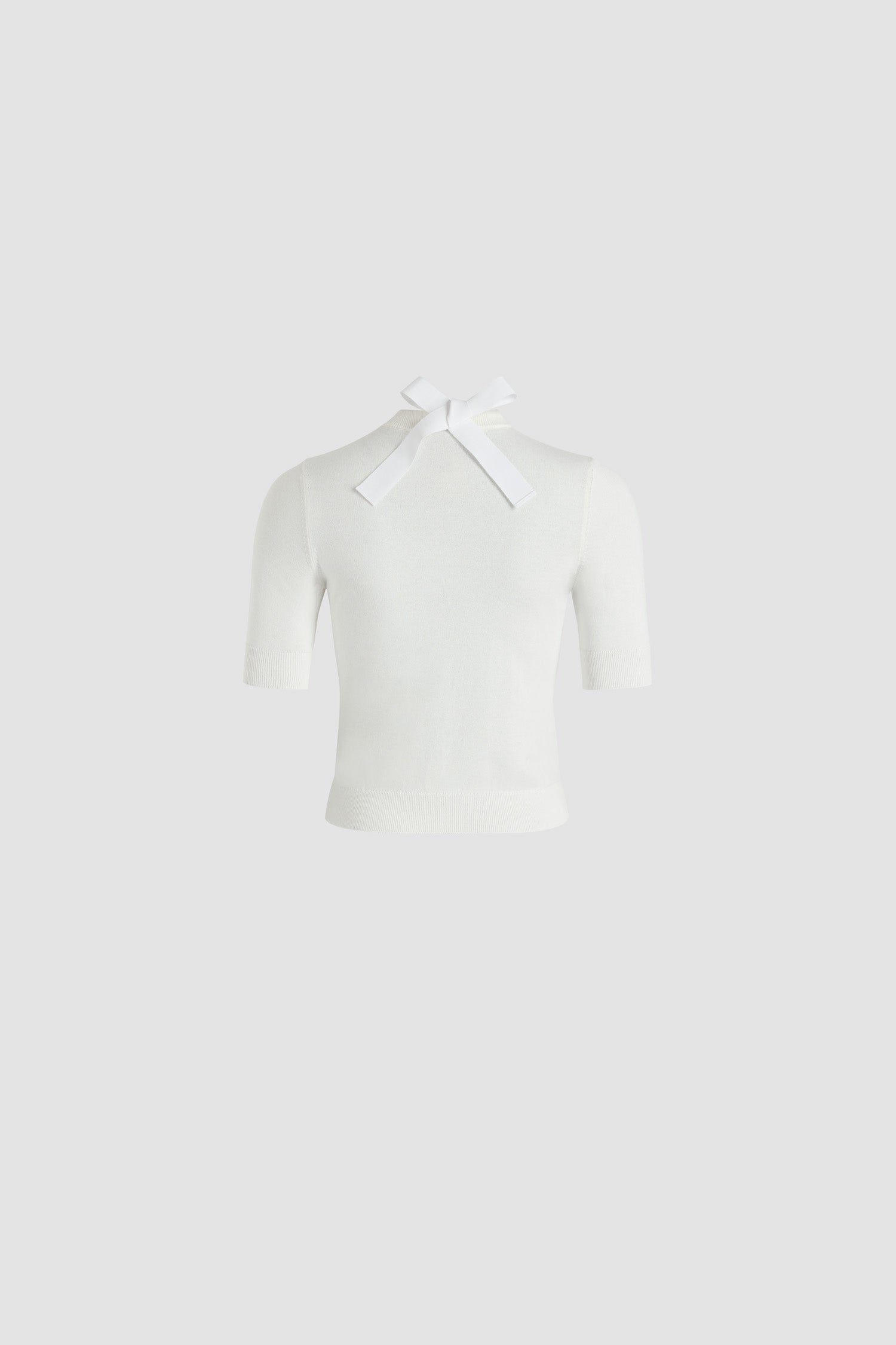 Patou - Bow collar jumper in organic cotton and polyester - White - White organic cotton and polyester jumper. Round neck with grosgrain ribbon at the back. Contrast Patou logo and JP intarsia at the chest. Short sleeves. Ribbed cuffs and hem.