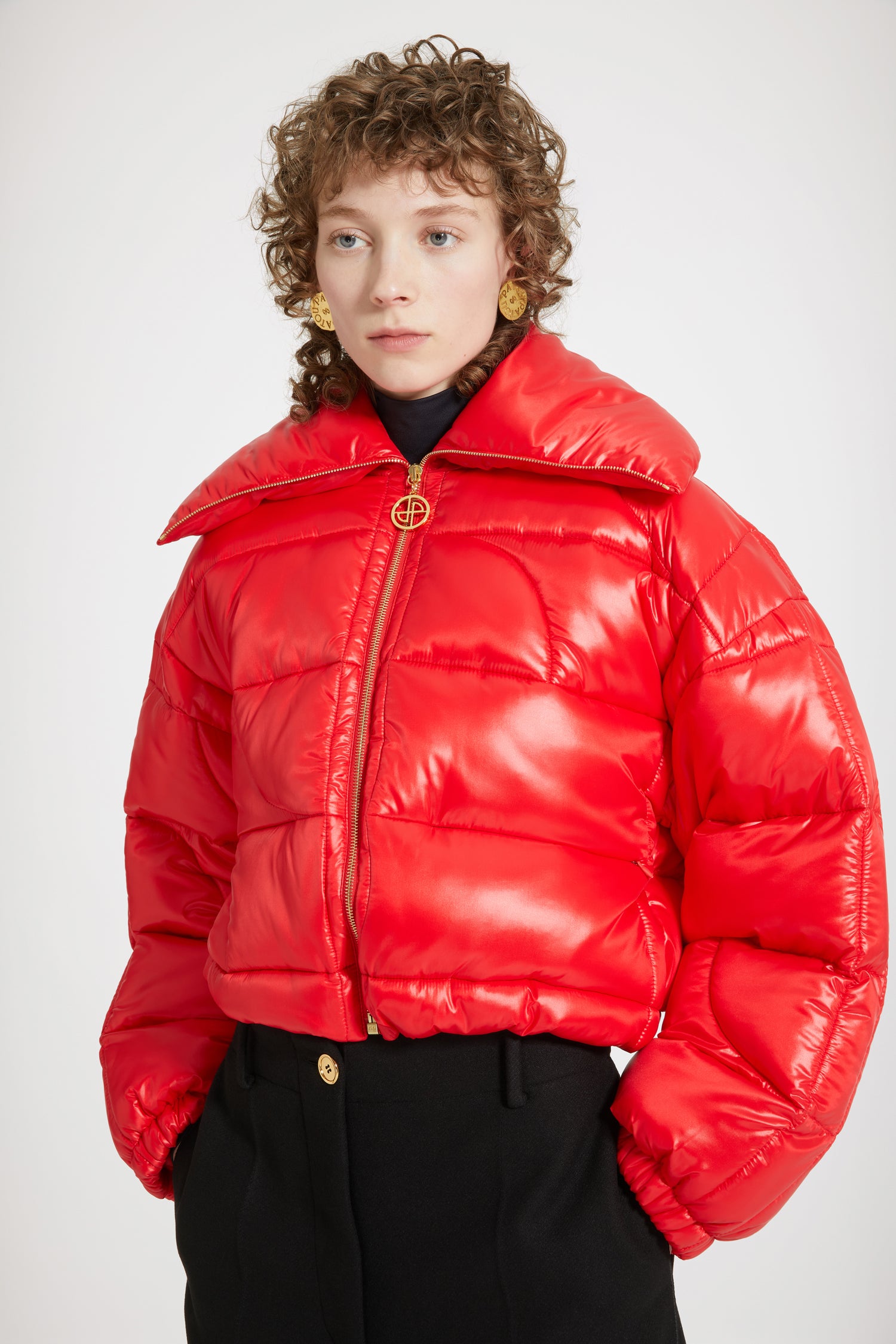 Patou - Short puffer jacket in eco-friendly polyamide - Red Ski Slope - The JP stamp of approval!Red eco-friendly polyamide jacket. Short padded style. High collar. Gold-tone zip with signature JP puller. Maxi JP matelassé at the back. Pockets at the sides. Drawstring waist. Elasticated cuffs.This jacket is short.