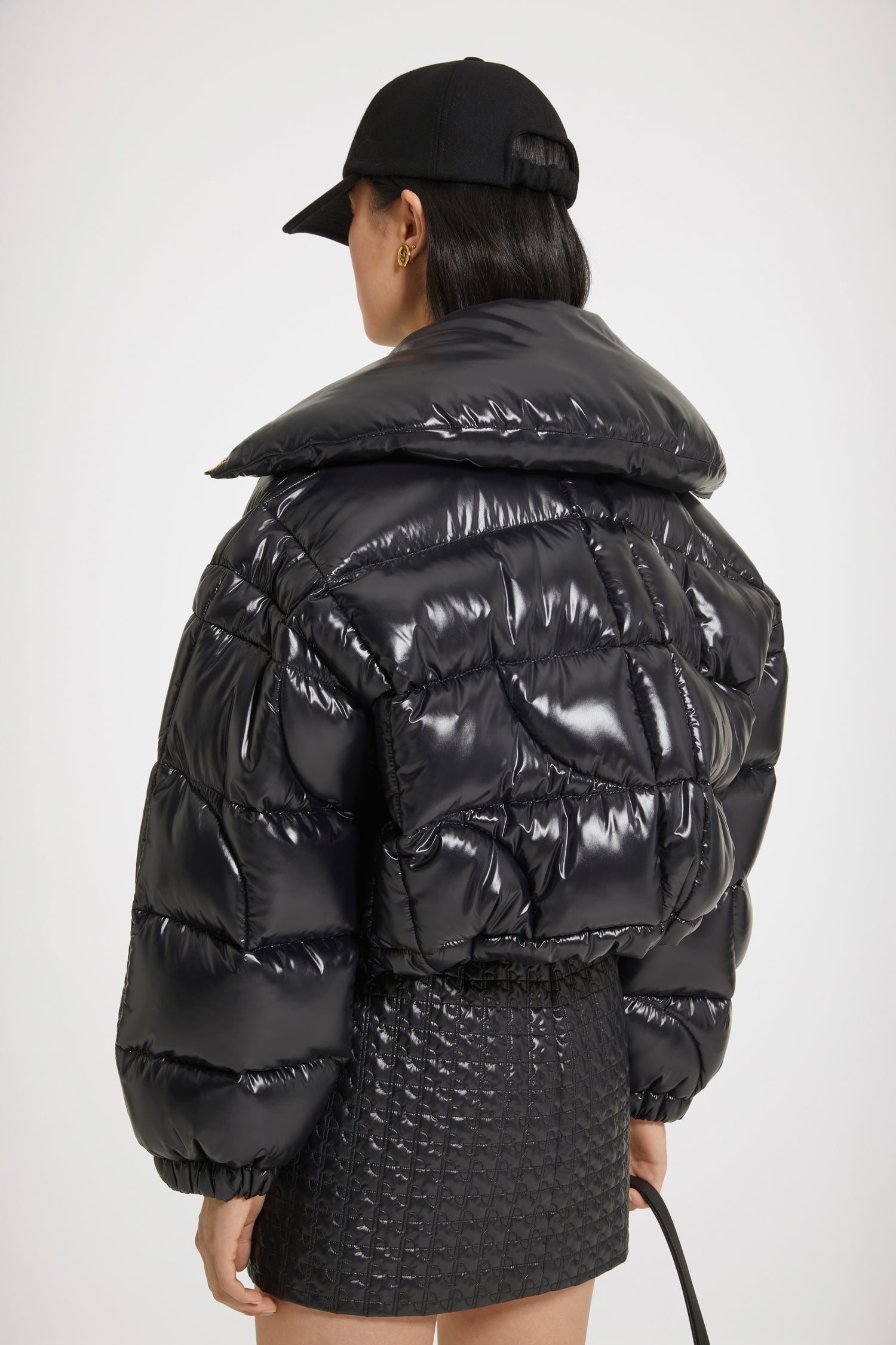 Patou - Short puffer jacket in eco-friendly polyamide - Black - The JP stamp of approval!Black eco-friendly polyamide jacket. Short padded style. High collar. Gold-tone zip with signature JP puller. Maxi JP matelassé at the back. Pockets at the sides. Drawstring waist. Elasticated cuffs.This jacket is short.