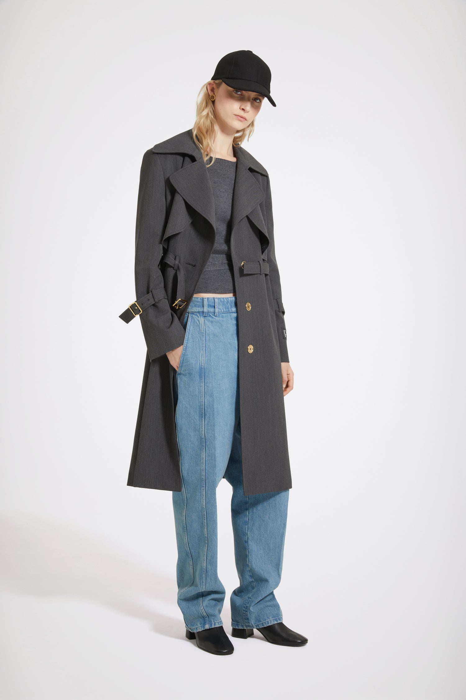 Patou - Trench coat in technical wool twill - Anthracite - The trench goes French.Anthracite grey technical wool twill trench coat. Tailored single-breasted silhouette. Knee length. Notch lapels. Storm flap at the front. Gold-tone Patou-engraved buttons at the front. Adjustable gold-tone buckle belt that sits at the waist. Side seam patch pockets at the front. Belted cuffs. Signature Patou label on the left arm. Signature curved seam at the back. Single back vent with gold-tone Patou-engraved button.