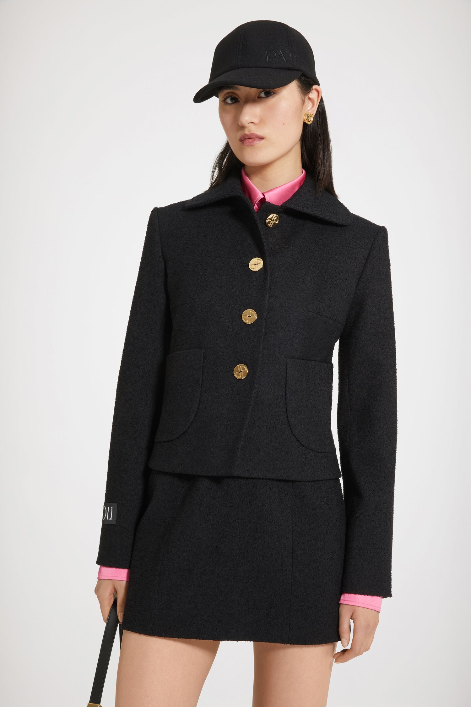Patou - Mini skirt in stretch tweed - Black - A maxi crush on the Patou mini skirt.Black cotton-blend stretch tweed skirt. High waist. Short length. Zip fastening at the back. Fully lined.