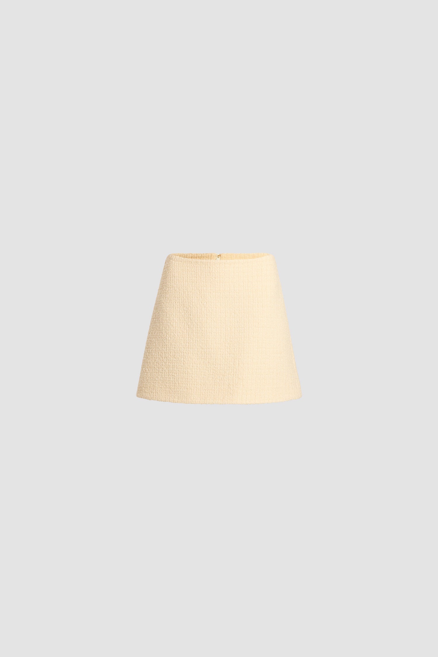 Patou - A-line mini skirt in sustainable wool blend tweed - Snowberry White - Snowberry White sustainable wool blend tweed skirt. Short length. Mid waist. A-line silhouette. Zip fastening at the back. Darts at the back. Lined.