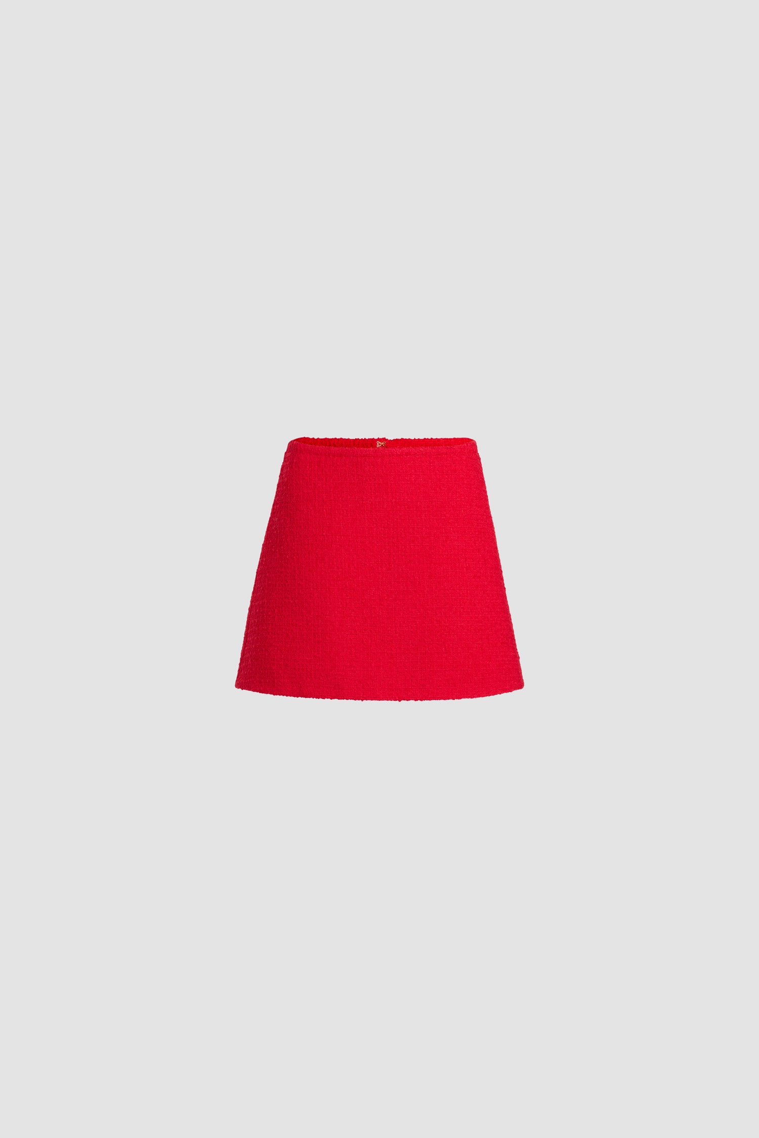 Patou - サステナブルウールブレンドツイード Aラインミニスカート - Scarlet Red - スカーレットレッドのサステナブル ウール混紡ツイードスカート。ショート丈。ミッドウエスト。Aラインのシルエット。バックにファスナー。後ろにダーツ。裏地付き。