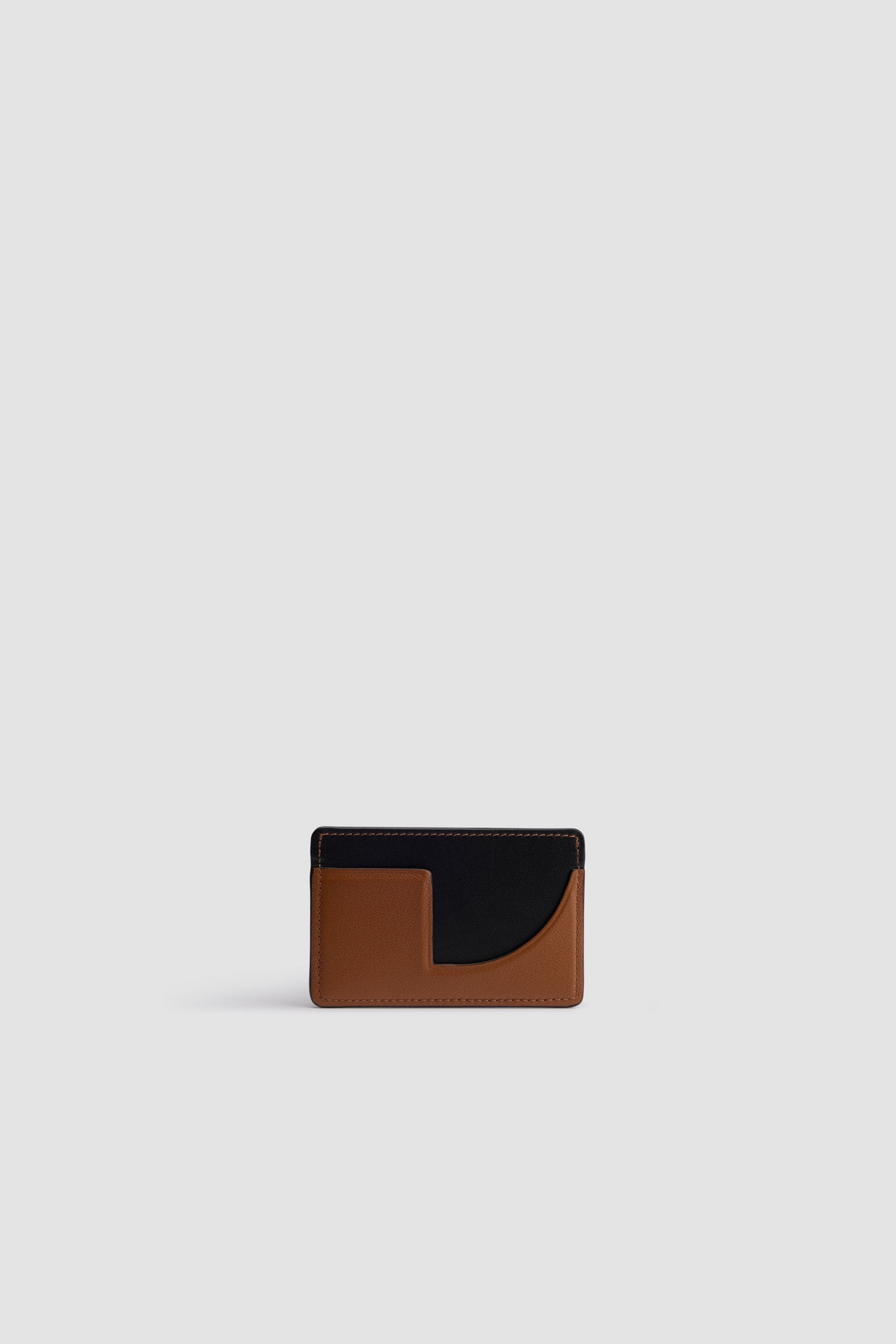 Patou - JP cardholder in leather - Black Chestnut - Black Chestnut two-tone leather cardholder. Two card slots, central compartment. Gold embossed Patou at the front, cut-out at the back.