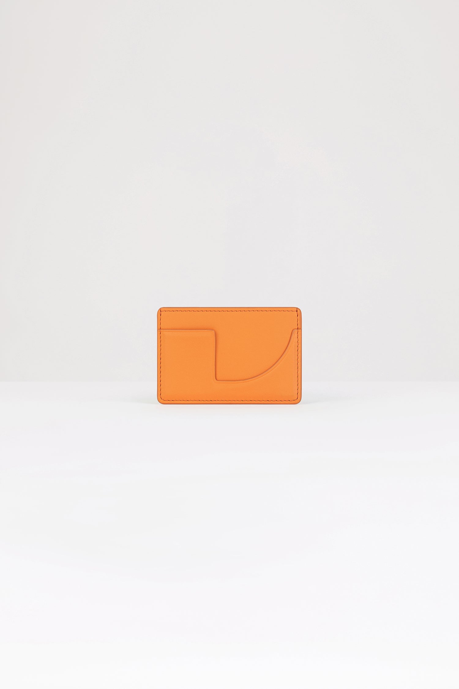 Patou - JP cardholder in leather - Bright Orange - A small piece of Patou for your everyday.Bright orange leather cardholder. Crafted using unique materials sourced from unused high-quality leather hides. Two card slots, central compartment. Gold embossed Patou at the front, cut-out at the back.
