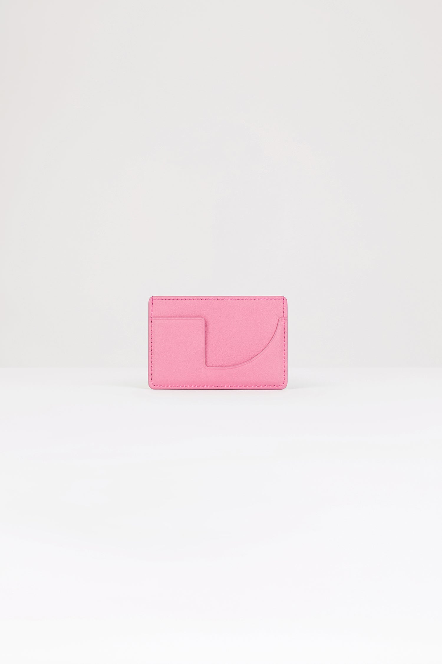 Patou - JP cardholder in leather - Pink - A small piece of Patou for your everyday.Pink leather cardholder. Two card slots, central compartment. Gold embossed Patou at the front, cut-out at the back.