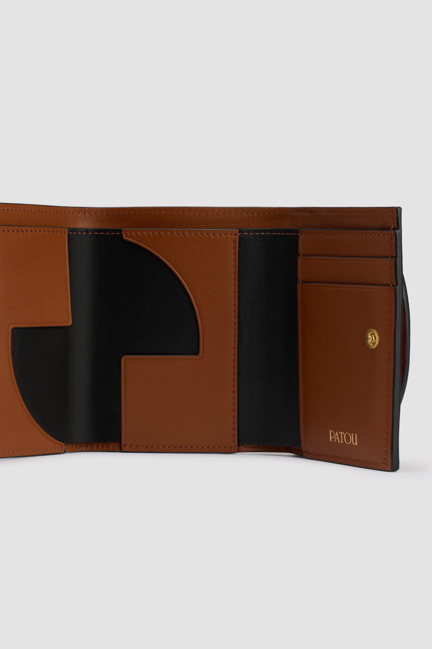 Patou - JP wallet in leather - Autumn Leaf - Autumn Leaf brown leather wallet. Gold-tone JP at the front. Snap button fastening. Multiple card slots and pockets, one large pocket for notes. JP cut-out and gold embossed Patou inside.
