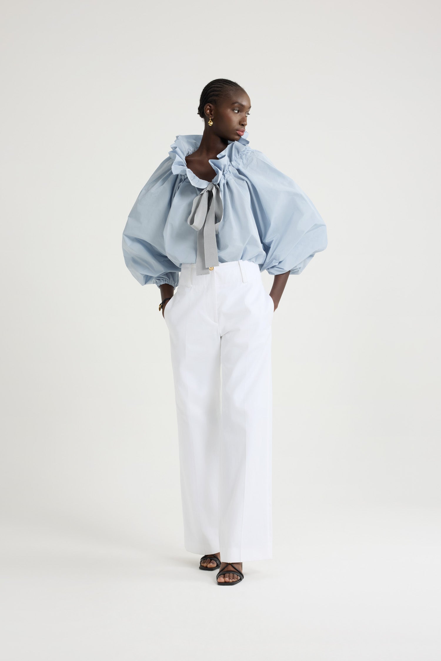 Patou - Iconic drawstring top in recycled faille - Pearl Blue - Pearl Blue recycled polyester faille top. High volume silhouette that can be worn knotted at the neck or off the shoulders. Drawstring collar with flounce at the front and long grosgrain ties. Batwing sleeves with elasticated cuffs. Elasticated waist.