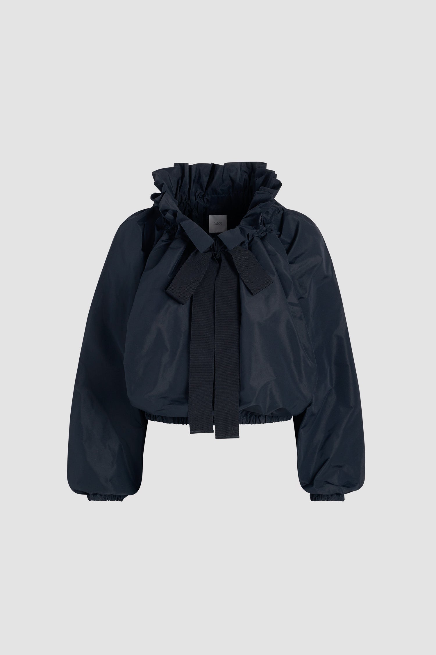 Patou - Top con maniche a palloncino in faglia riciclato - Navy Black - Top in faglia riciclato blu nero. Vestibilità oversize. Può essere indossato chiuso sul collo o in modo da scoprire le spalle. Collo con dettaglio di balza sul fronte e coulisse in grosgrain. Maniche a pipistrello con polsini elasticizzati. Vita elasticizzata.