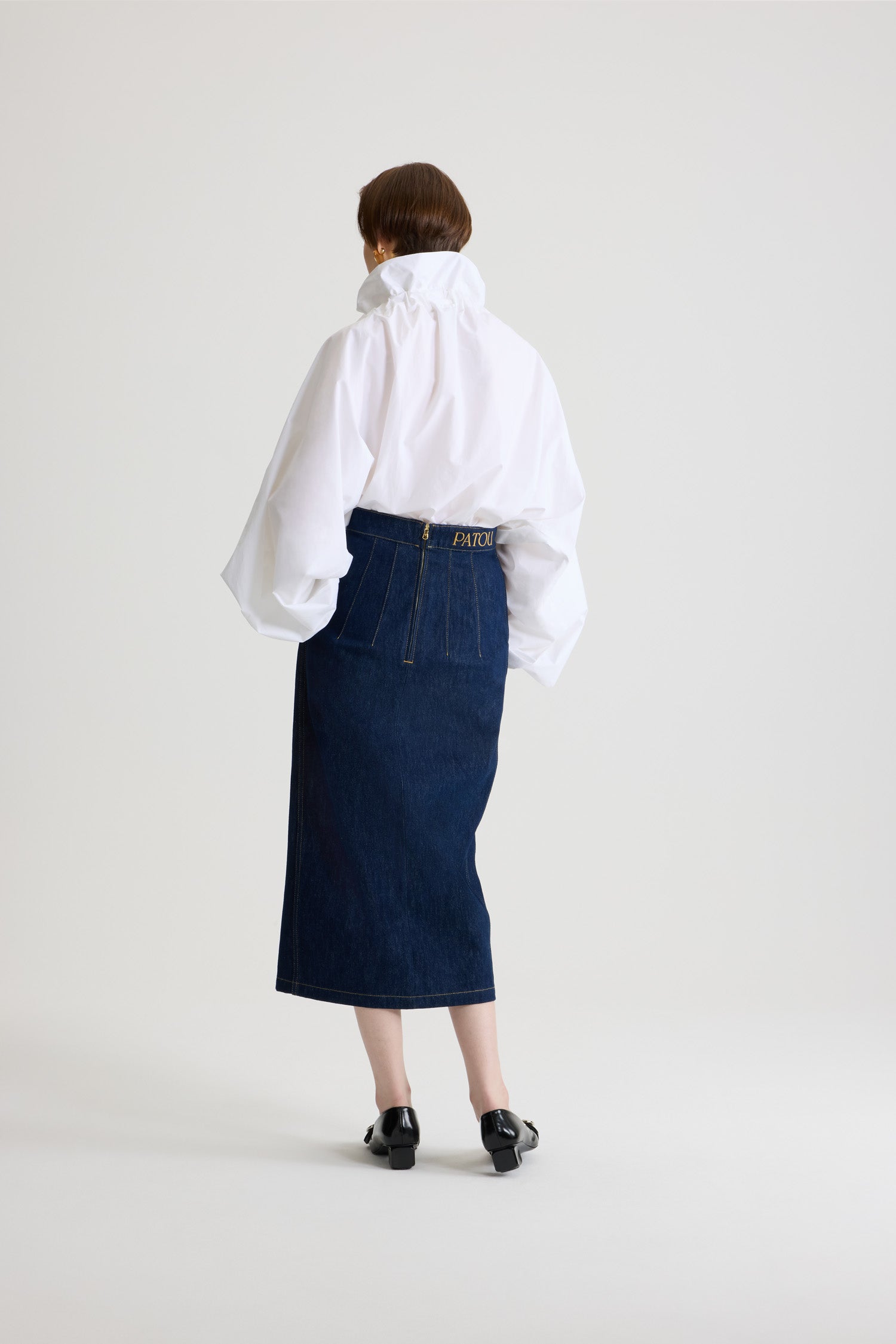Patou - La Patou Blouse in organic cotton poplin - White - An everyday proposition of bold sleeves and couture ribbons.White organic poplin cotton top. High volume silhouette. Drawstring collar with ruching. Batwing sleeves with elasticated cuffs. Elasticated waist.