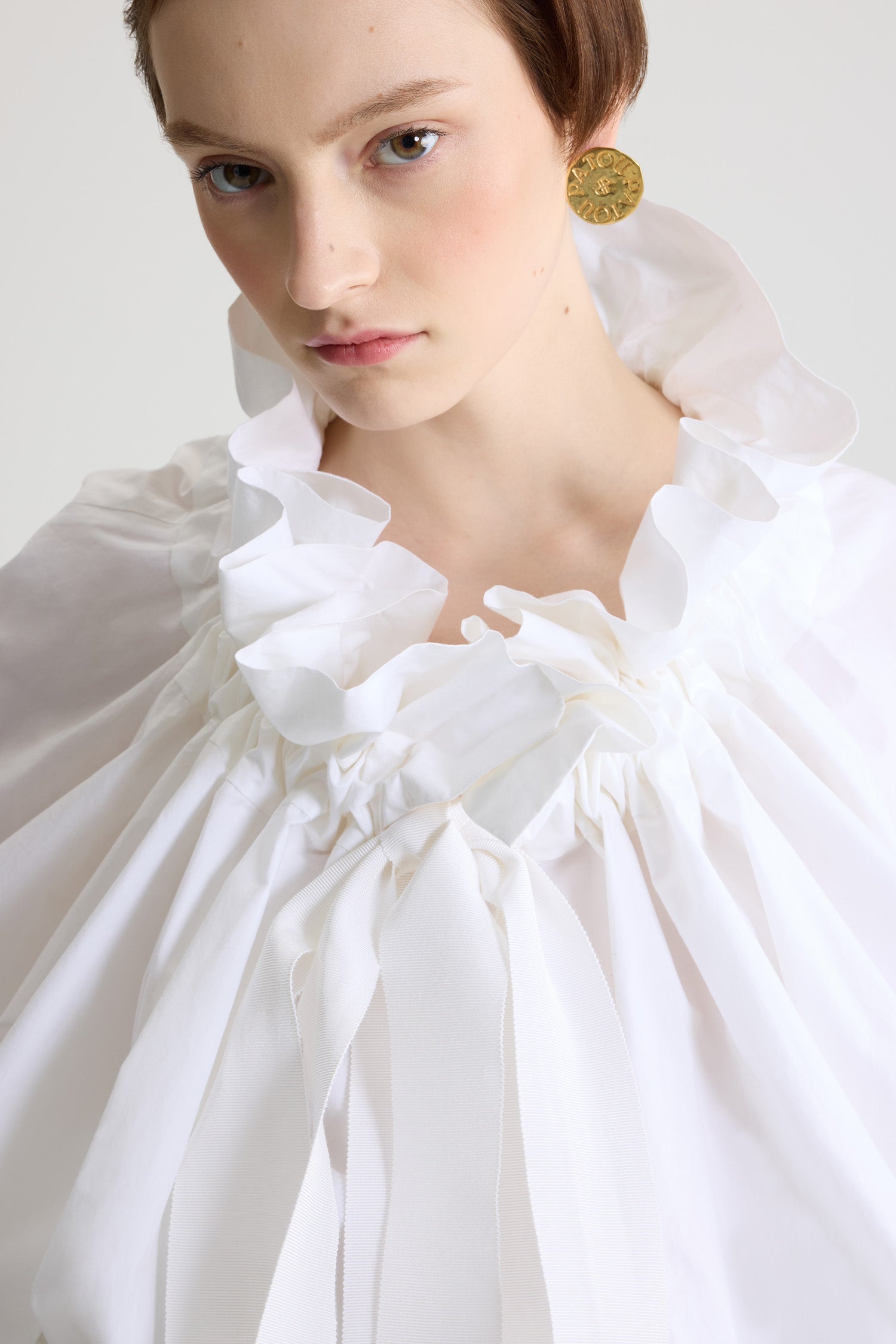 Patou - La Patou Blouse in organic cotton poplin - White - An everyday proposition of bold sleeves and couture ribbons.White organic poplin cotton top. High volume silhouette. Drawstring collar with ruching. Batwing sleeves with elasticated cuffs. Elasticated waist.