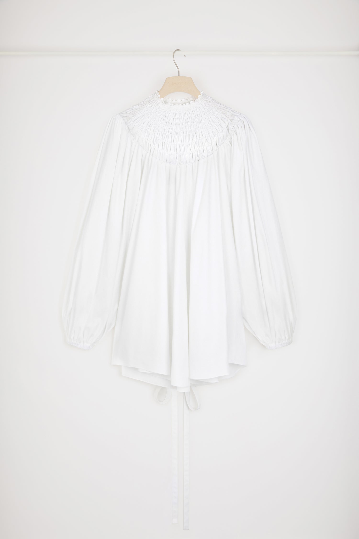 Patou - Smock collar tunic in organic cotton - White - Dress or tunic? Time to work your styling magic.White organic cotton poplin tunic. High neckline with smocked detailing. Embroidered JP at the back. Volume sleeves with puff shoulders and elasticated cuffs. Removable belt at the waist that can be tied at the front or back. Can be worn as a mini dress.