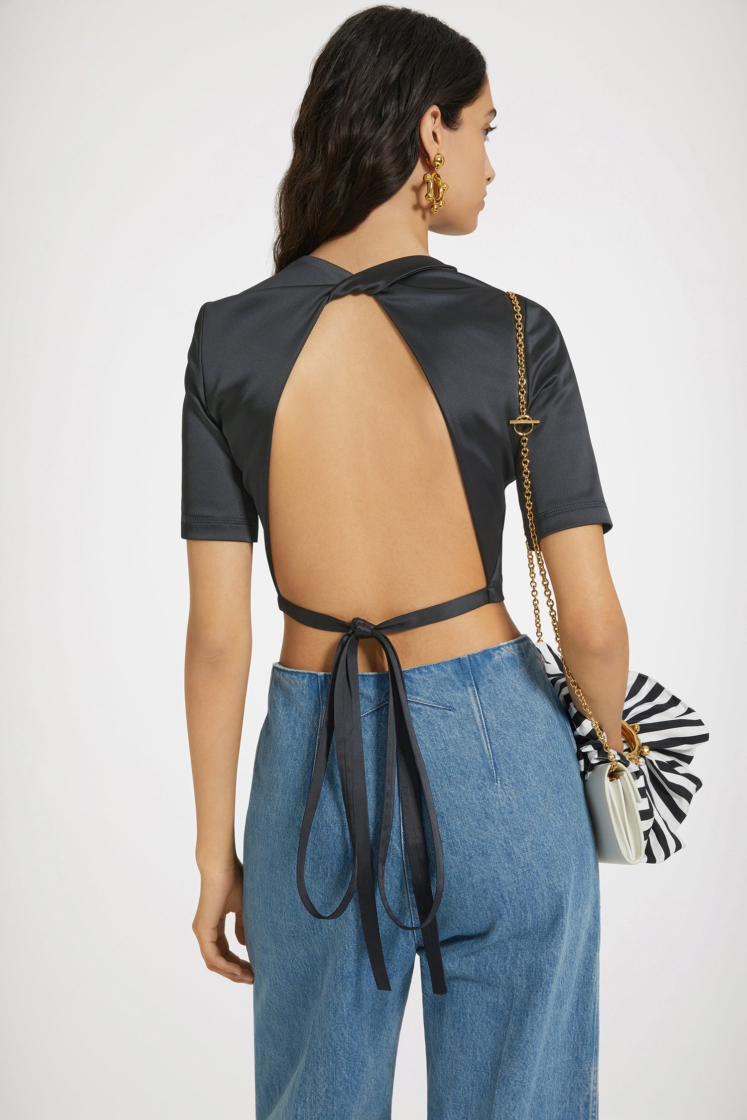 Patou - Open back top in satin - Black - Party at the back.Black satin top. Cropped length. Fitted silhouette. Round neck. Open back with twist detail. Ties that fasten at the back.This style is very fitted.