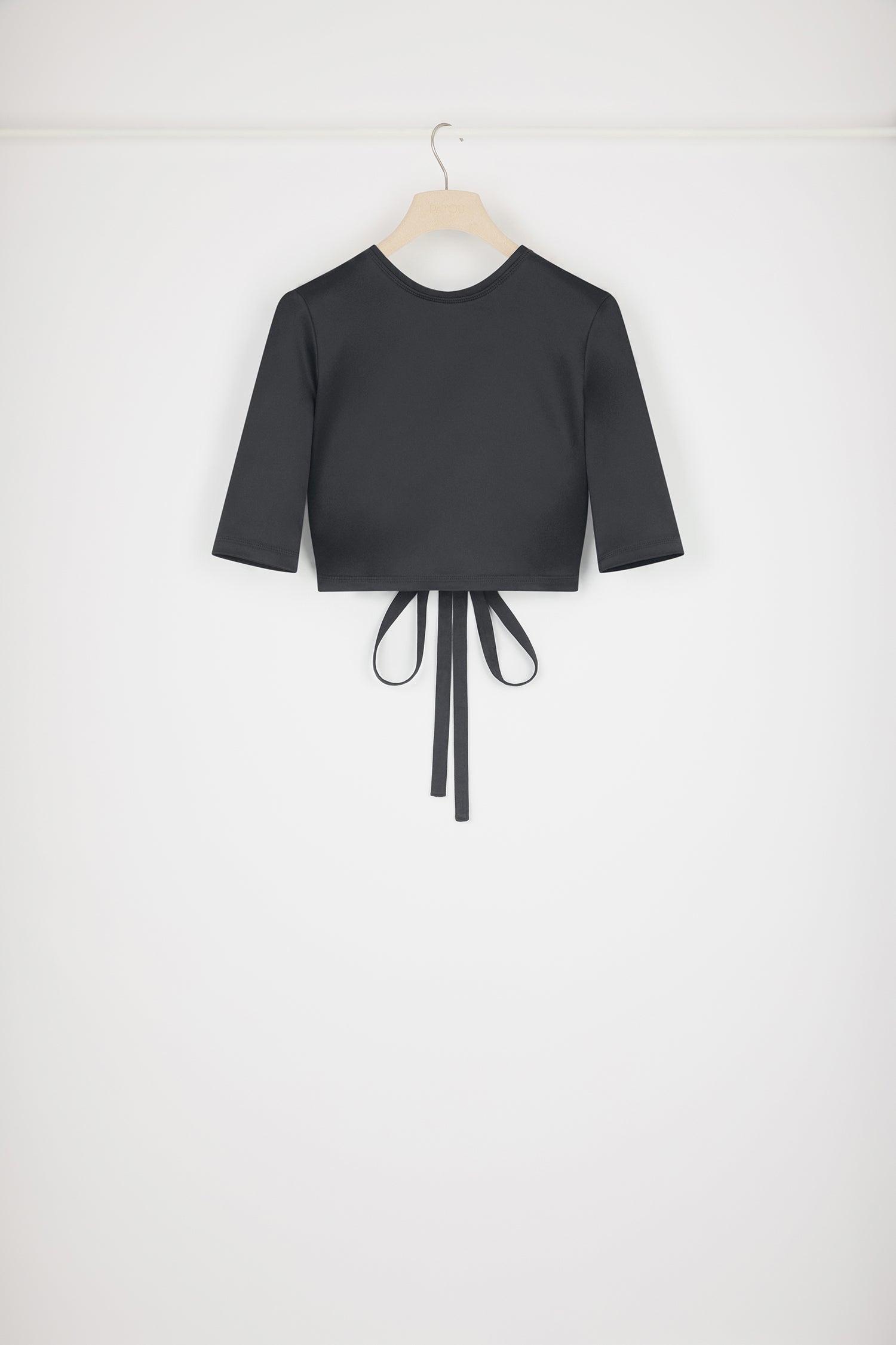 Patou - Open back top in satin - Black - Party at the back.Black satin top. Cropped length. Fitted silhouette. Round neck. Open back with twist detail. Ties that fasten at the back.This style is very fitted.