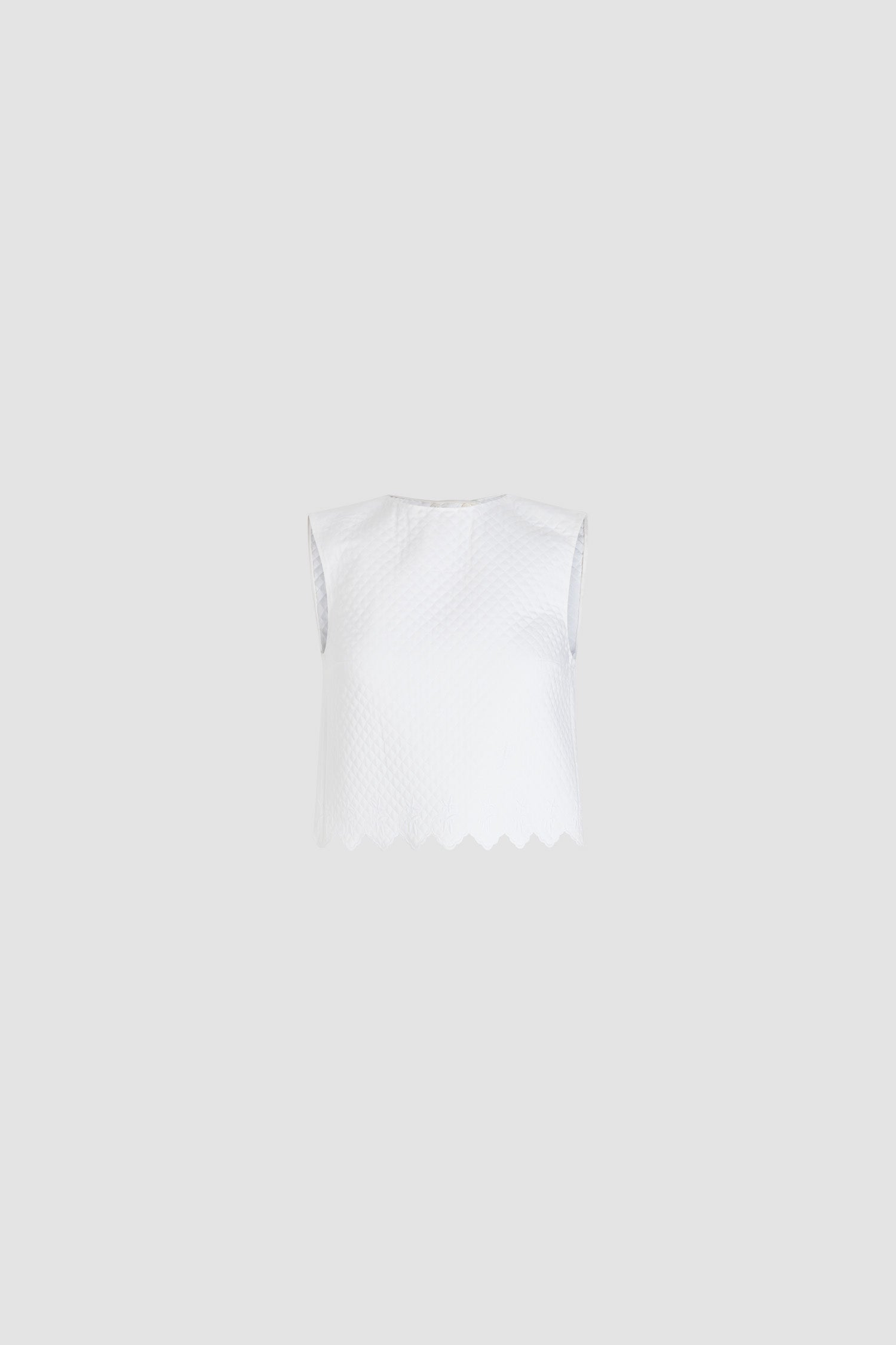 Patou - Crop top in quilted sustainable viscose blend - White - To ensure that this piece can accompany you throughout your life, we kindly ask you not to fold it.White sustainable viscose-blend javanaise top. Boutis quilting. Cropped length. Round neck. Split back. Button fastening at the back collar. Embroidered JP calligraphy monogram at the front. Embroidered floral motifs and scalloped hem.