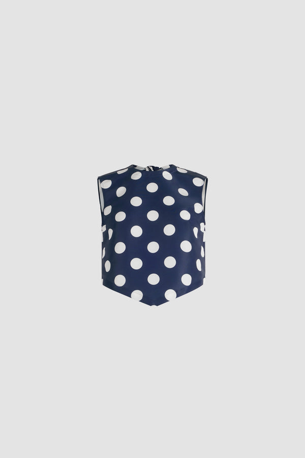 Patou - Top noué en ottoman imprimé recyclé - Navy Polka Dots - Top en ottoman recyclé. Imprimé pois. Coupe courte. Col rond. Dos fendu avec fermeture par nœud. Ourlet à découpe en V.