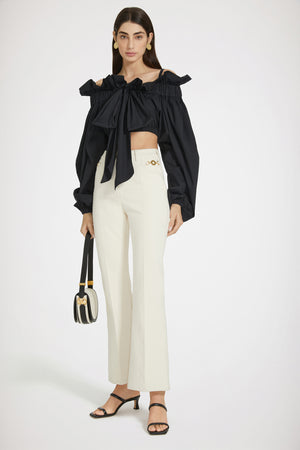 Pantalone flare in denim di cotone rigenerato