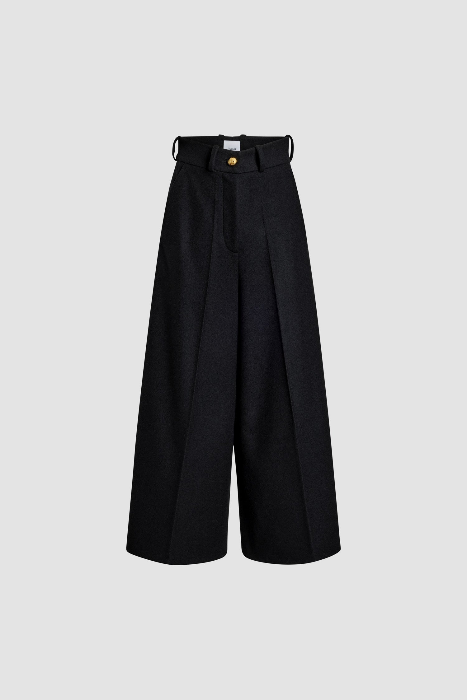 Patou - Wide-legged trousers in sustainable wool and cashmere blend - Black - Black sustainable wool and cashmere blend trousers. Wide leg. High waist. Fastens via a gold-tone JP-engraved button and concealed zip at the front. Belt loops, two pockets at the sides. Stitched creases at the front.