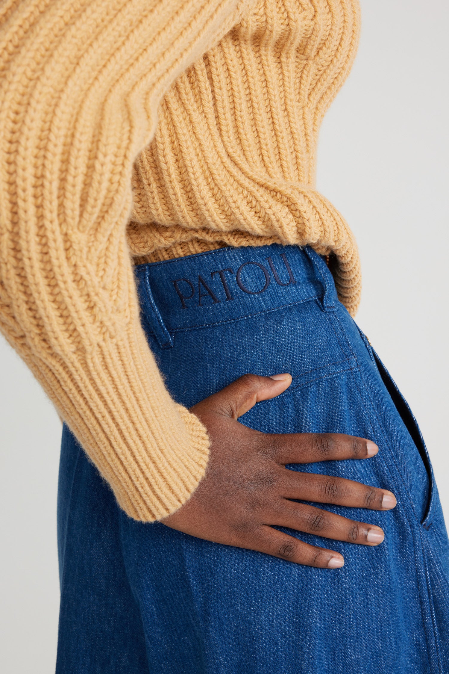 Patou - Wide-legged trousers in organic cotton denim - Stonewash - Stonewash organic cotton denim trousers. Wide leg. High waist. Fastens via a gold-tone Patou-engraved button and concealed zip at the front. Belt loops, two pockets at the sides. Stitched creases at the front.