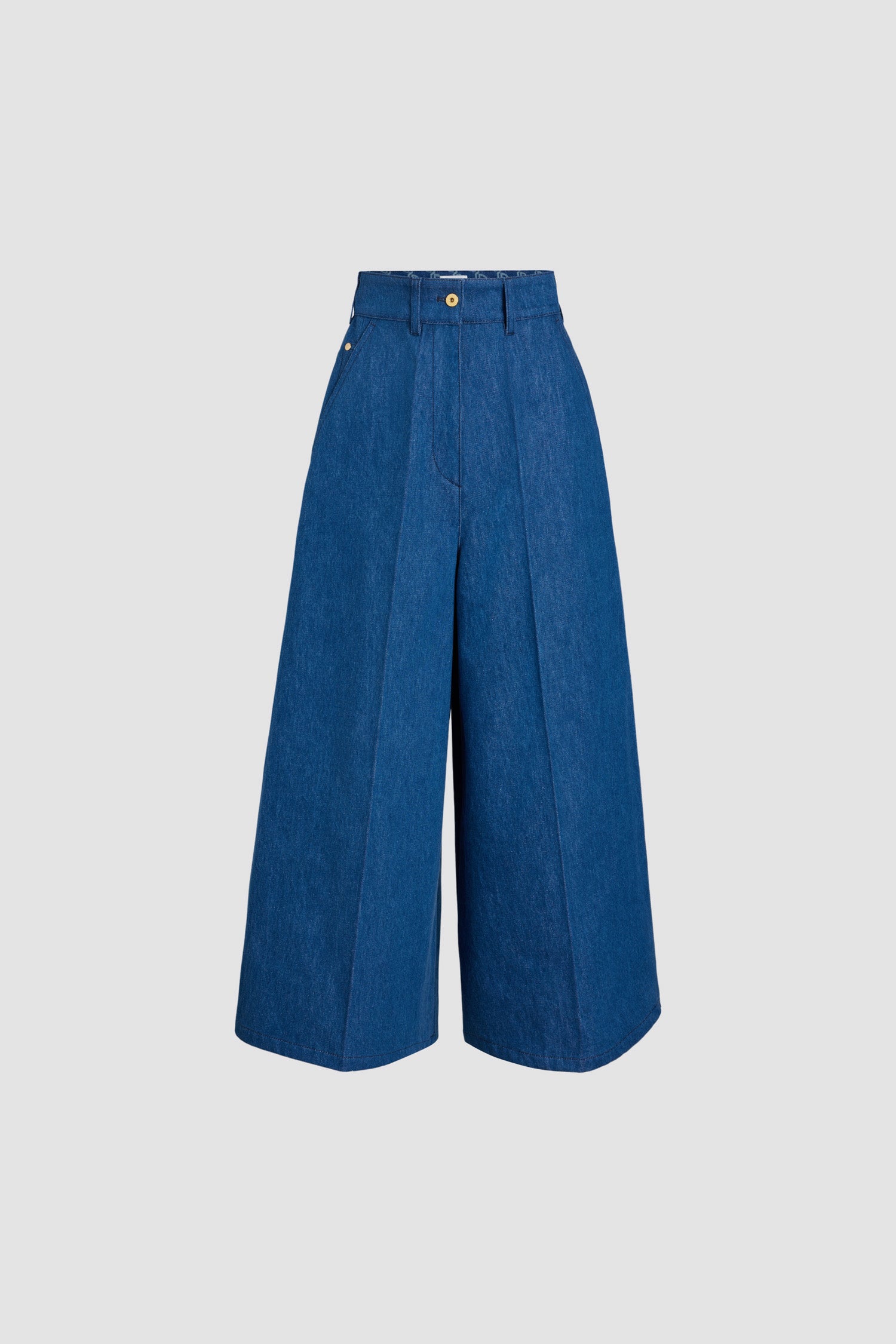 Patou - Wide-legged trousers in organic cotton denim - Stonewash - Stonewash organic cotton denim trousers. Wide leg. High waist. Fastens via a gold-tone Patou-engraved button and concealed zip at the front. Belt loops, two pockets at the sides. Stitched creases at the front.