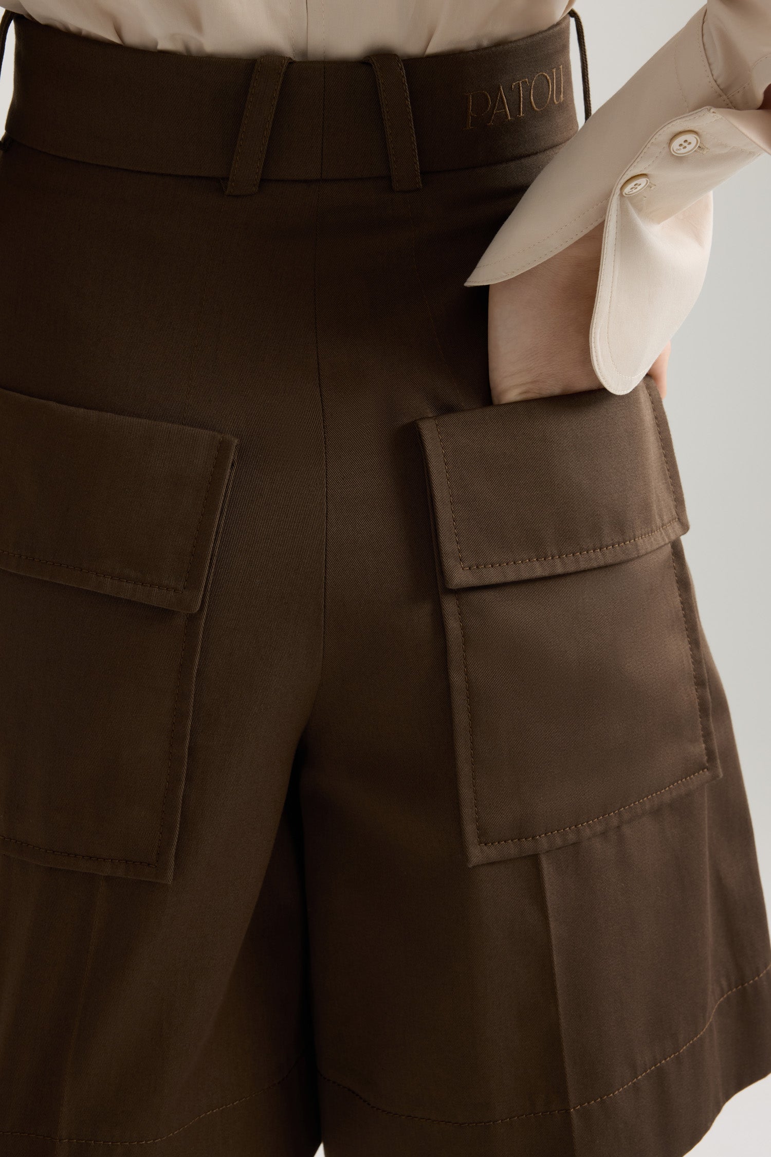 Patou - Bermudas in organic cotton gabardine - Java Brown - Java Brown organic cotton gabardine bermudas. High rise. Belt loops. Fastens via a gold-tone JP monogram-engraved button and concealed zip at the front. Pressed creases at the front. Patch pockets at the back. Embroidered Patou logo on the waistband.