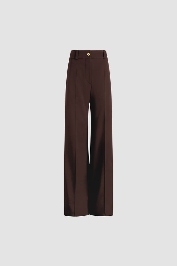 Patou - Taillierte Hose mit ausgestelltem Bein aus nachhaltiger technischer Wolle - Smoked Ebony - Hose aus nachhaltigem technischem Wolltwill in Rauchig-Ebenholz. Langes ausgestelltes Bein. Goldfarbener Knopf mit JP-Monogrammgravur und verdeckter Reißverschluss vorne. Gürtelschlaufen. Seitentaschen. Nähfalte vorne und hinten.