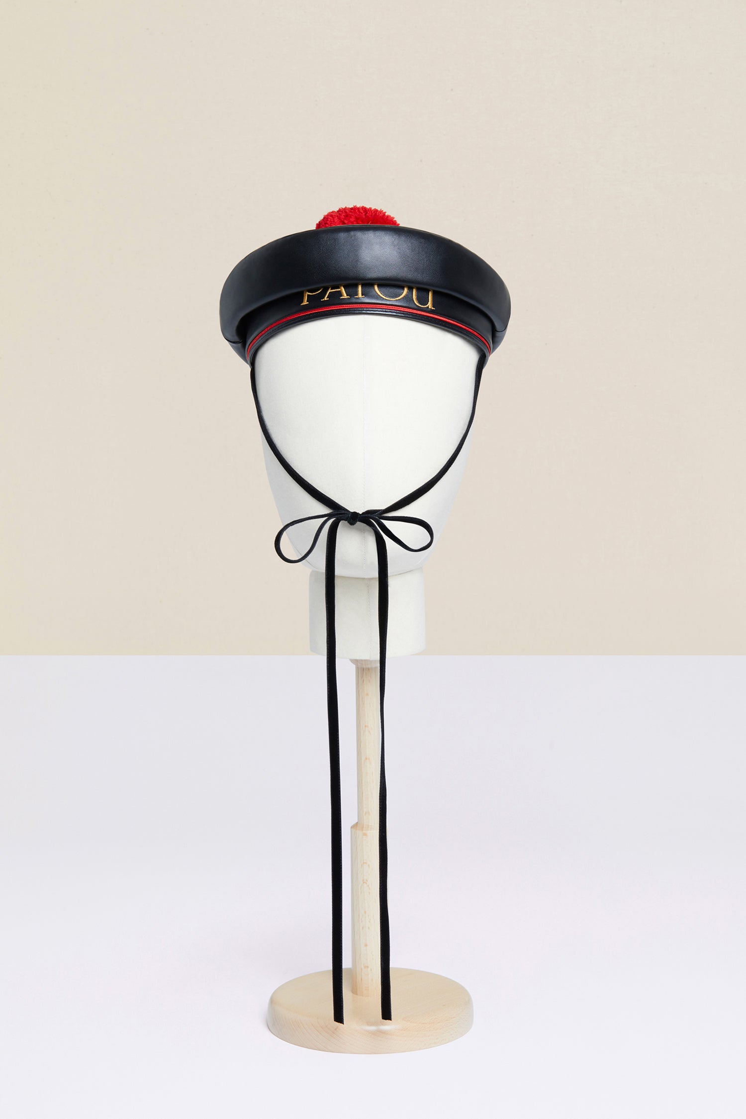 Patou - Cappello da marinaio in similpelle - Black - Il pompon firma il cappello.Cappello da marinaio in similpelle nera. Logo Patou ricamato in lettere oro. Chiusura con lacci di velluto. Pompon rosso rimovibile.