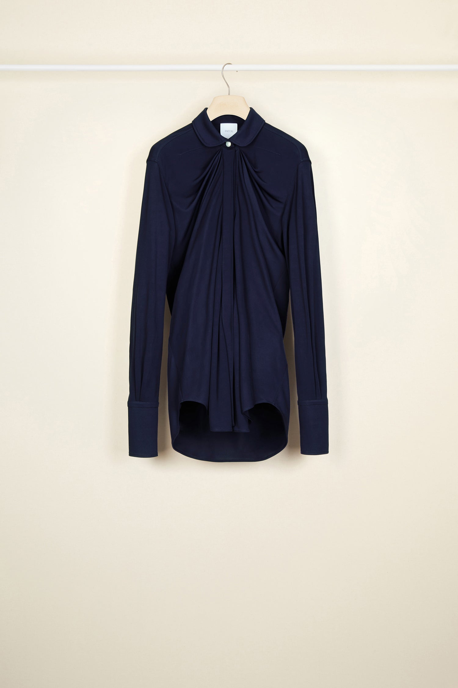 Patou - Peter Pan collar jersey blouse - Ink - A wider collar palette.Ink blue longline jersey blouse. An iconic Patou style with a smaller Peter Pan collar. Draped silhouette. Mother-of-pearl button at the top, hidden buttons down the front. Buttoned cuffs.