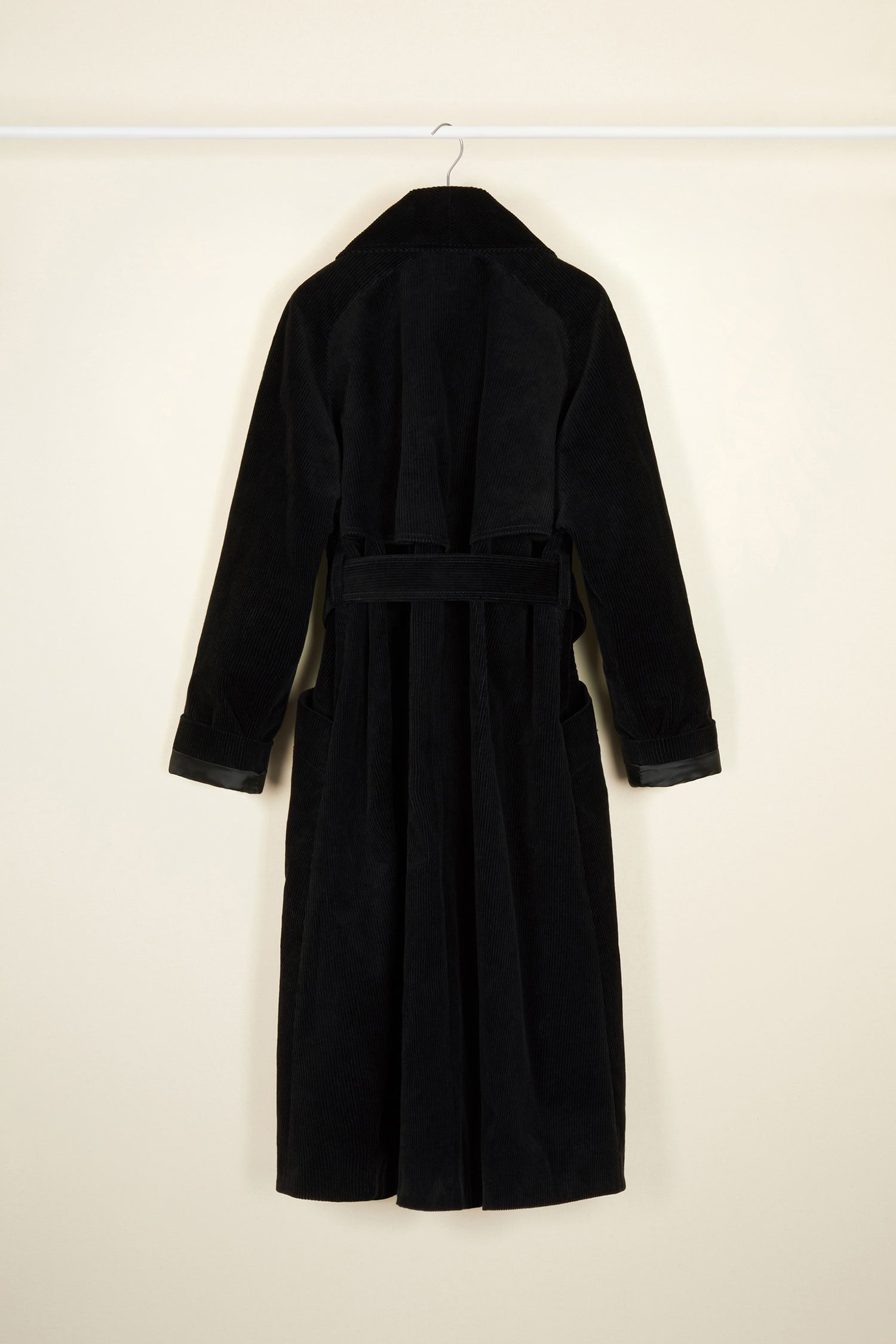 Patou - Corduroy trenchcoat - Black - A tailoring classic with a soft velvet touch.Signature Patou trenchcoat in black corduroy. Double-breasted style with a slight A-line silhouette. Button fastening and belted waist. Two pockets at the sides. Fully lined.