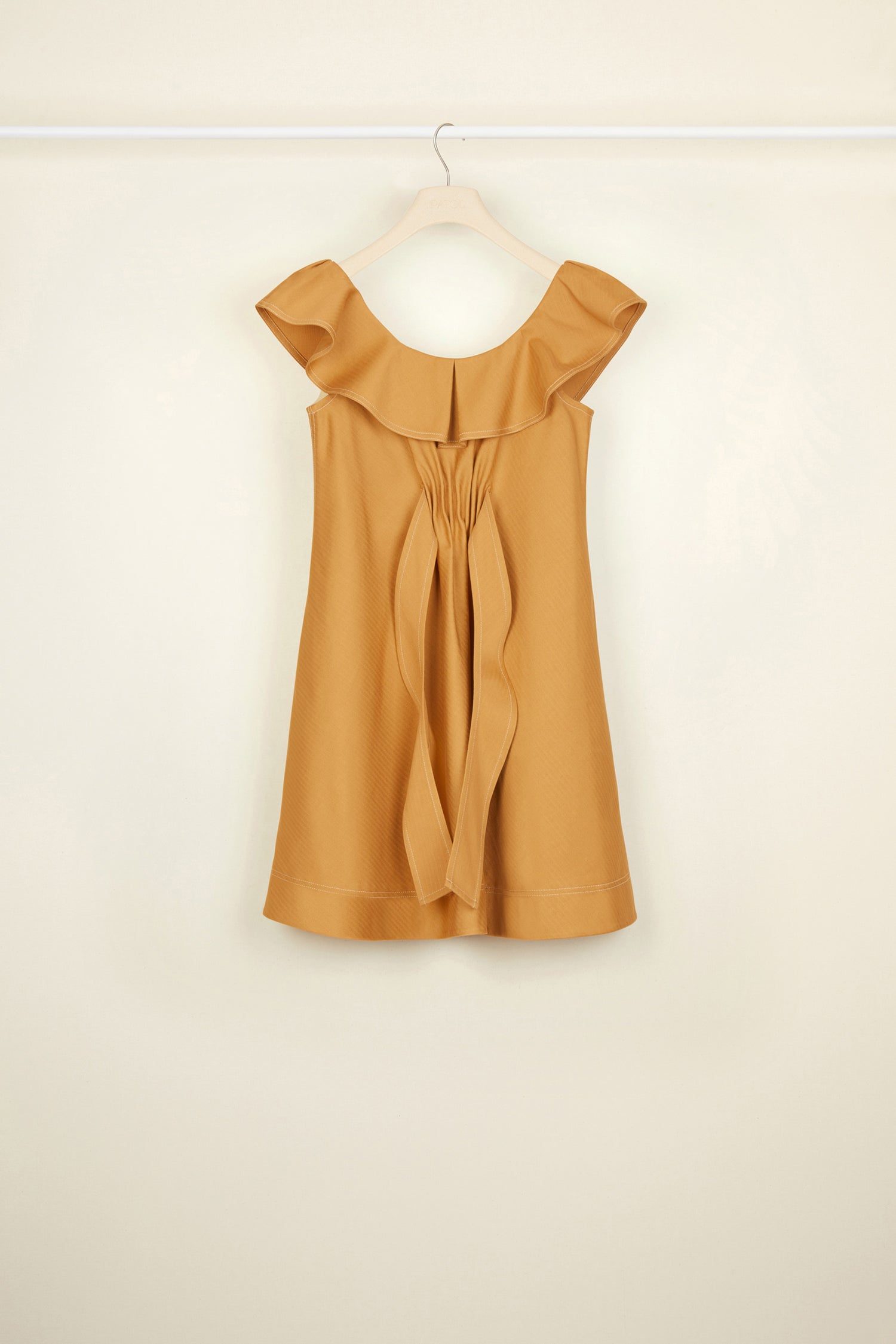 Patou - Frilly herringbone cotton minidress - Copper - The frills that lighten up heavy cotton.Copper-hued heavy herringbone cotton mini dress with contrasting white topstitching. Slight A-line silhouette. Sleeveless style with a frilly neckline. Ruching and loose panels at the front. Pockets at the sides. Concealed zip fastening.