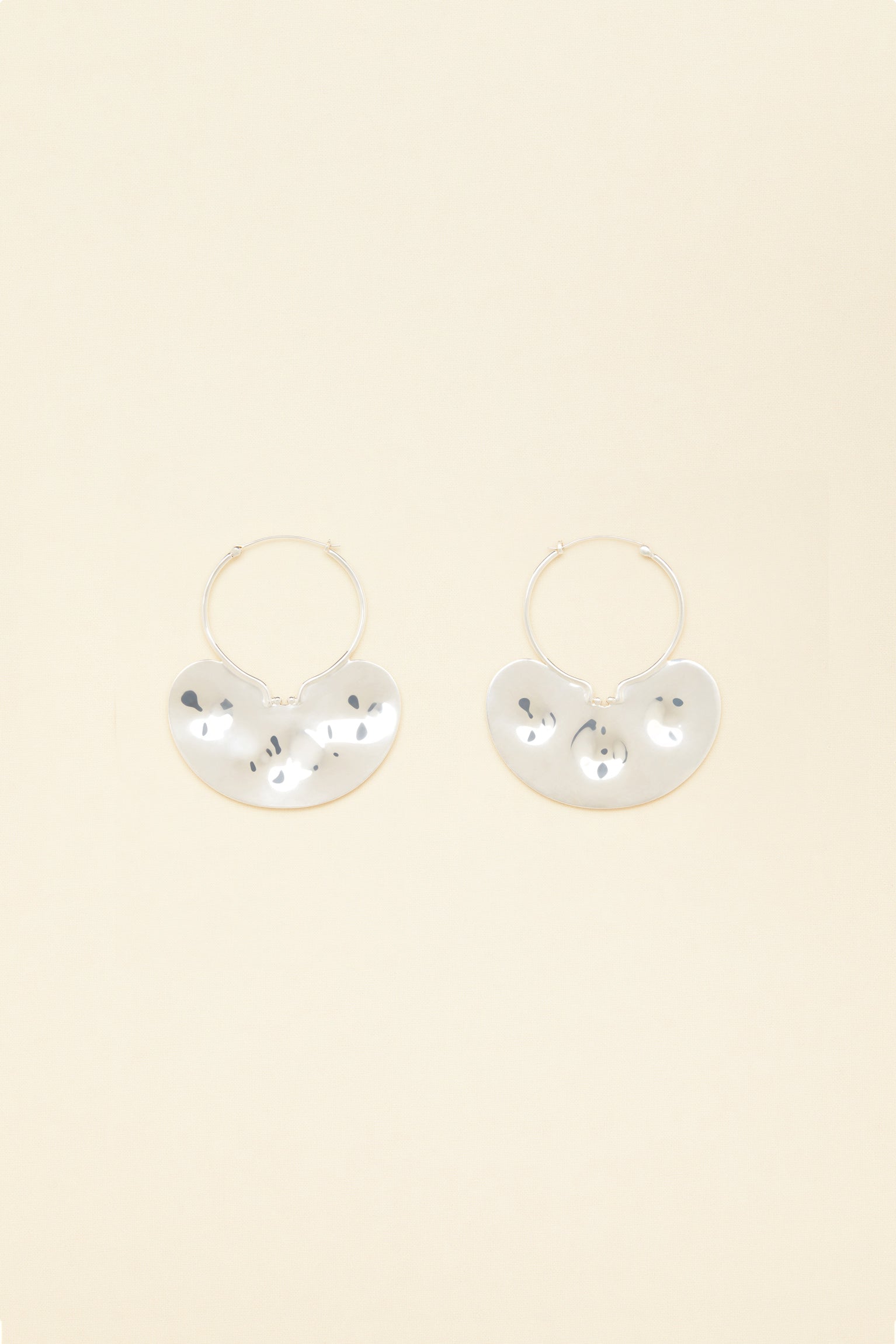 Patou - Small hammered brass hoop earrings - Silver - A classic.. with a twist!Small silver-plated brass hoop earrings with attached hammered plate engraved with the Patou logo.