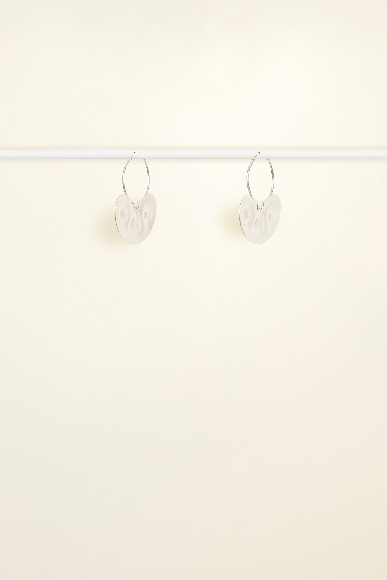 Patou - Small hammered brass hoop earrings - Silver - A classic.. with a twist!Small silver-plated brass hoop earrings with attached hammered plate engraved with the Patou logo.