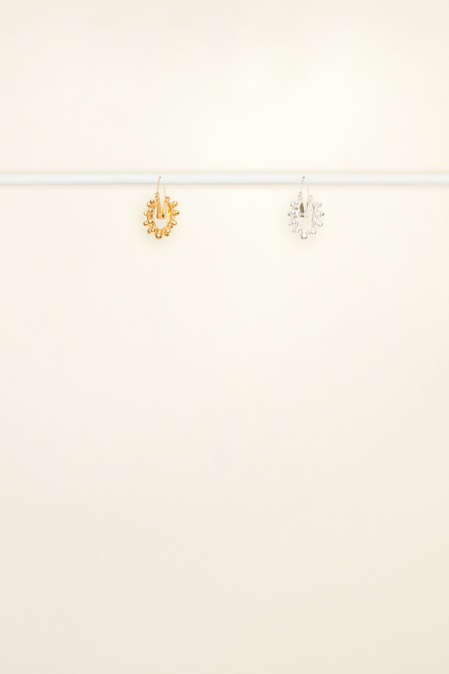 Patou - Two-tone pearl hoop earrings - Gold Silver - Gold and silver form a striking alliance. Brass hoop earrings with pearl-shaped embellishments all around. One in gold, one in silver.