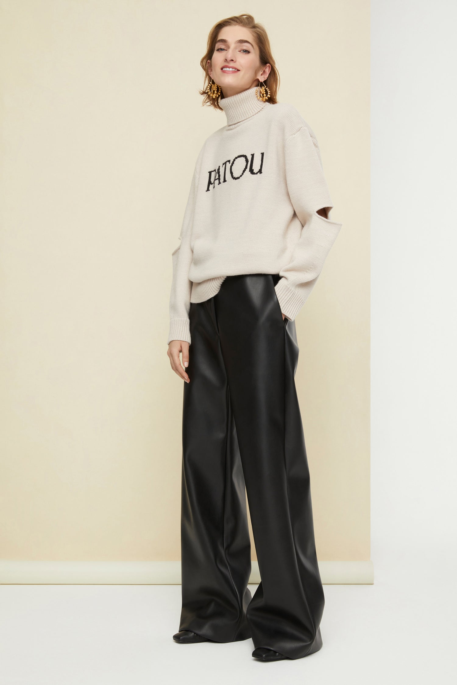 Patou - Oversized cut-out Patou jumper - Chestnut - Patou, always and everyday.Chestnut beige wool turtleneck jumper. Oversized silhouette. Lettering logo on the front in contrasting black. Cut-out elbows. Ribbed collar, cuffs and hem.