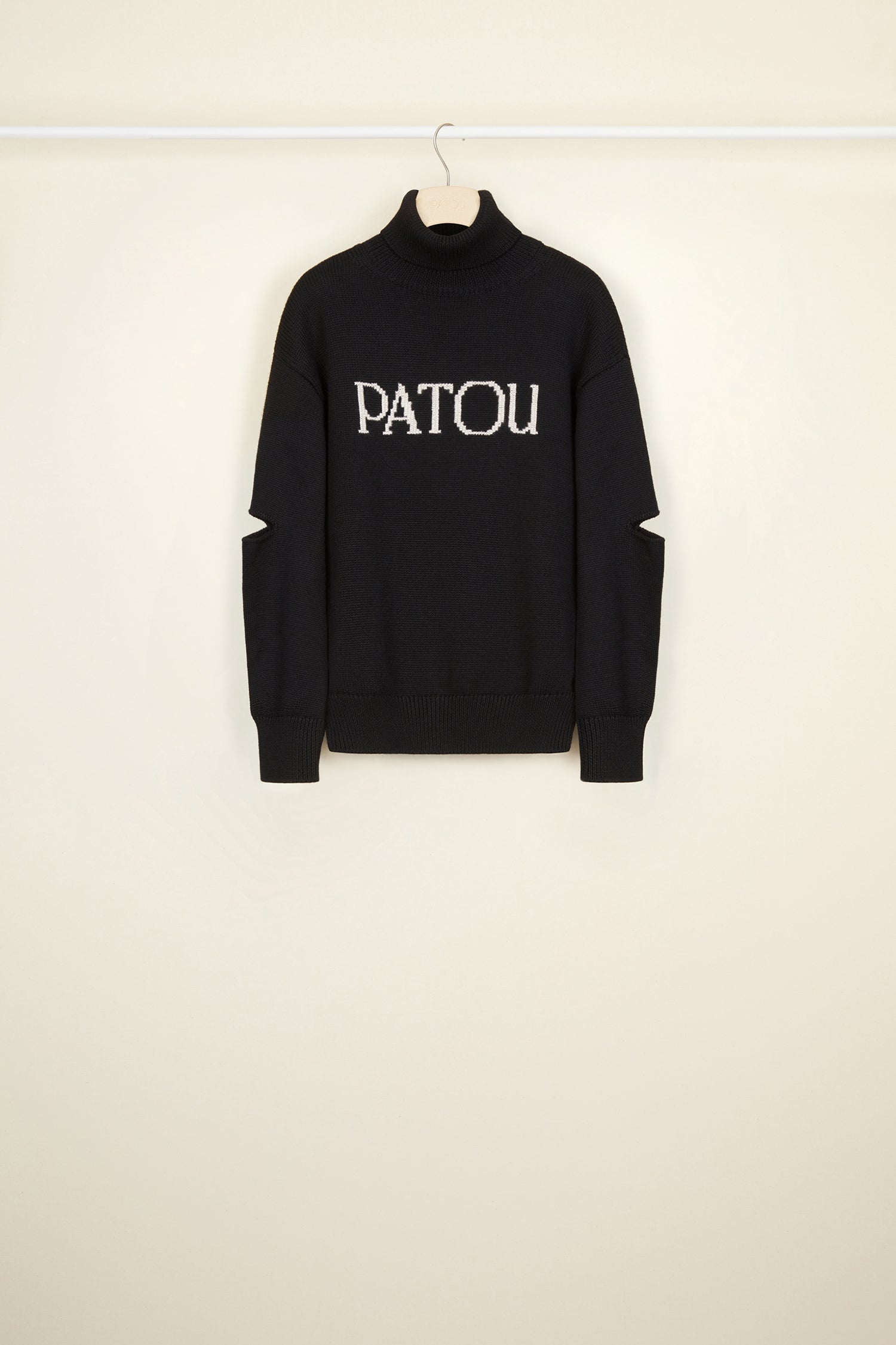 Patou - Oversized cut-out Patou jumper - Black - Patou, always and everyday.Black wool turtleneck jumper. Oversized silhouette. Lettering logo on the front in contrasting white. Cut-out elbows. Ribbed collar, cuffs and hem.