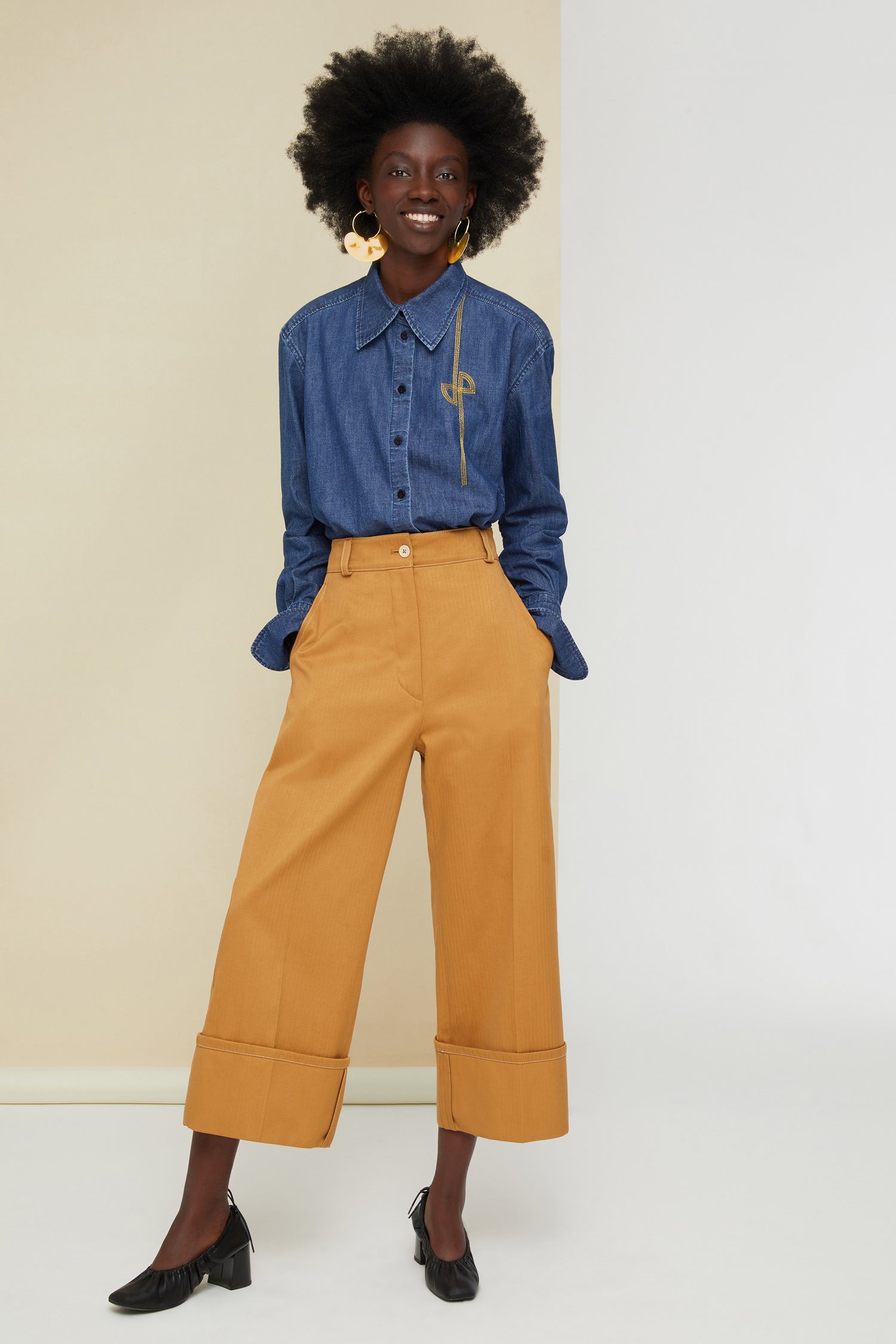 Patou - Iconic herringbone cotton trousers - Copper - A contemporary perspective on a classic pattern.A classic Patou trouser silhouette in copper-hued heavy herringbone cotton. Straight fit, exaggerated cuffs. Fastens via a JP-engraved button and zip at the front. Belt loops, two side pockets. Signature darts at the back.