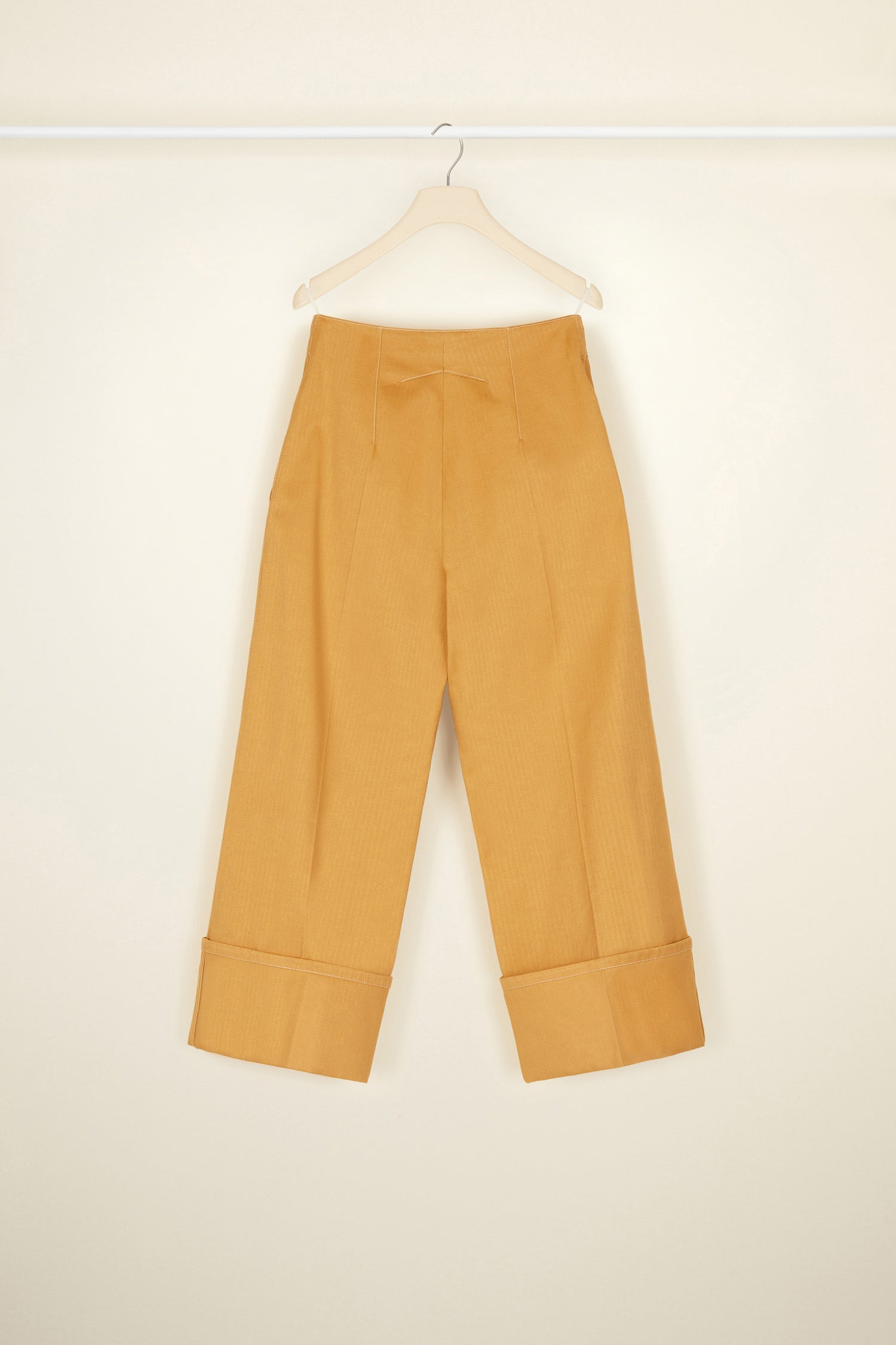 Patou - Iconic herringbone cotton trousers - Copper - A contemporary perspective on a classic pattern.A classic Patou trouser silhouette in copper-hued heavy herringbone cotton. Straight fit, exaggerated cuffs. Fastens via a JP-engraved button and zip at the front. Belt loops, two side pockets. Signature darts at the back.