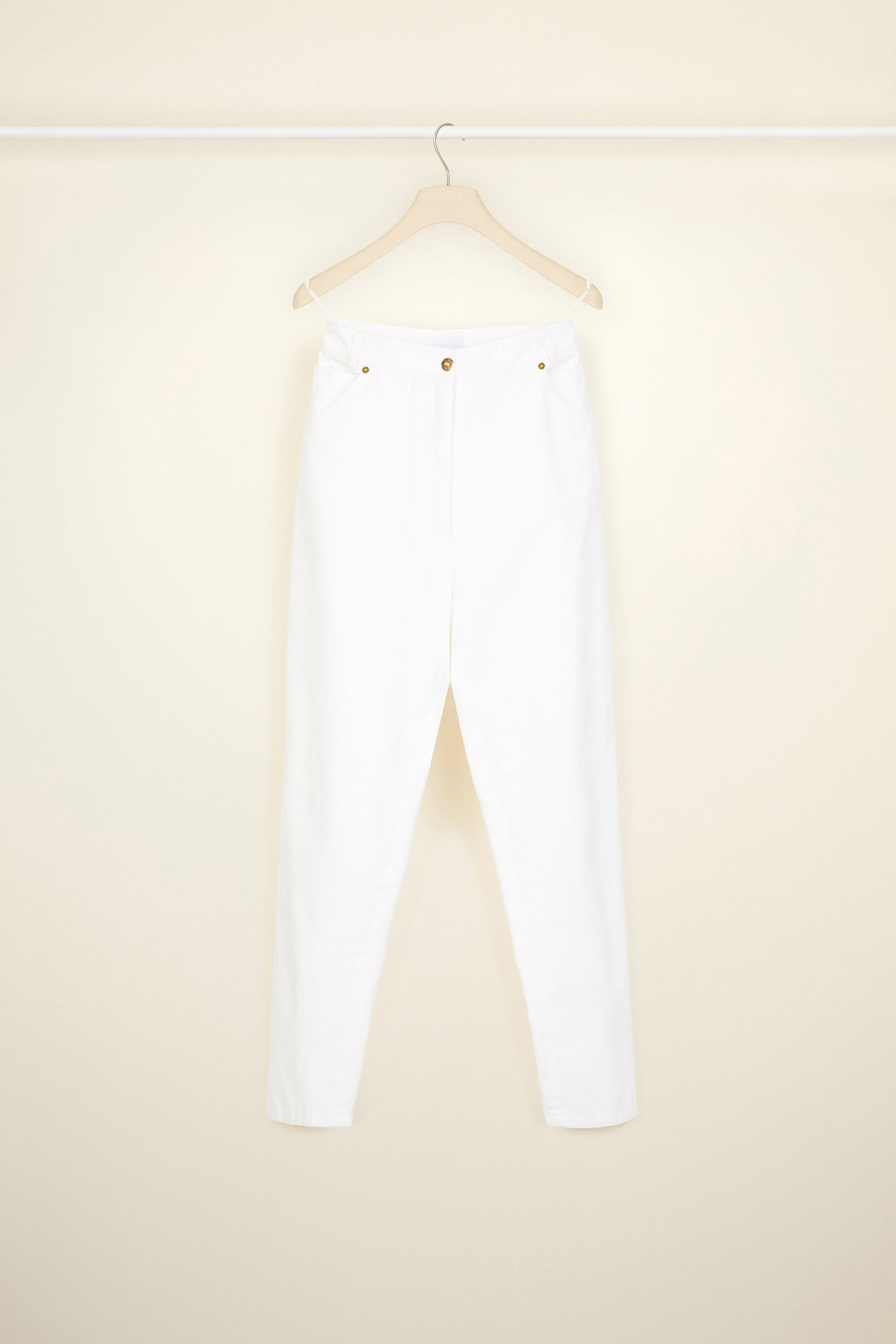 Patou - Corduroy carrot trousers - Pearl - A novel direction for everyday trousers.A new tapered silhouette in pearl white corduroy. Five-pocket style with gold-coloured hardware. Button and zip fastening at the front. Belt loops. Embroidered lettering logo and signature dart at the back.
