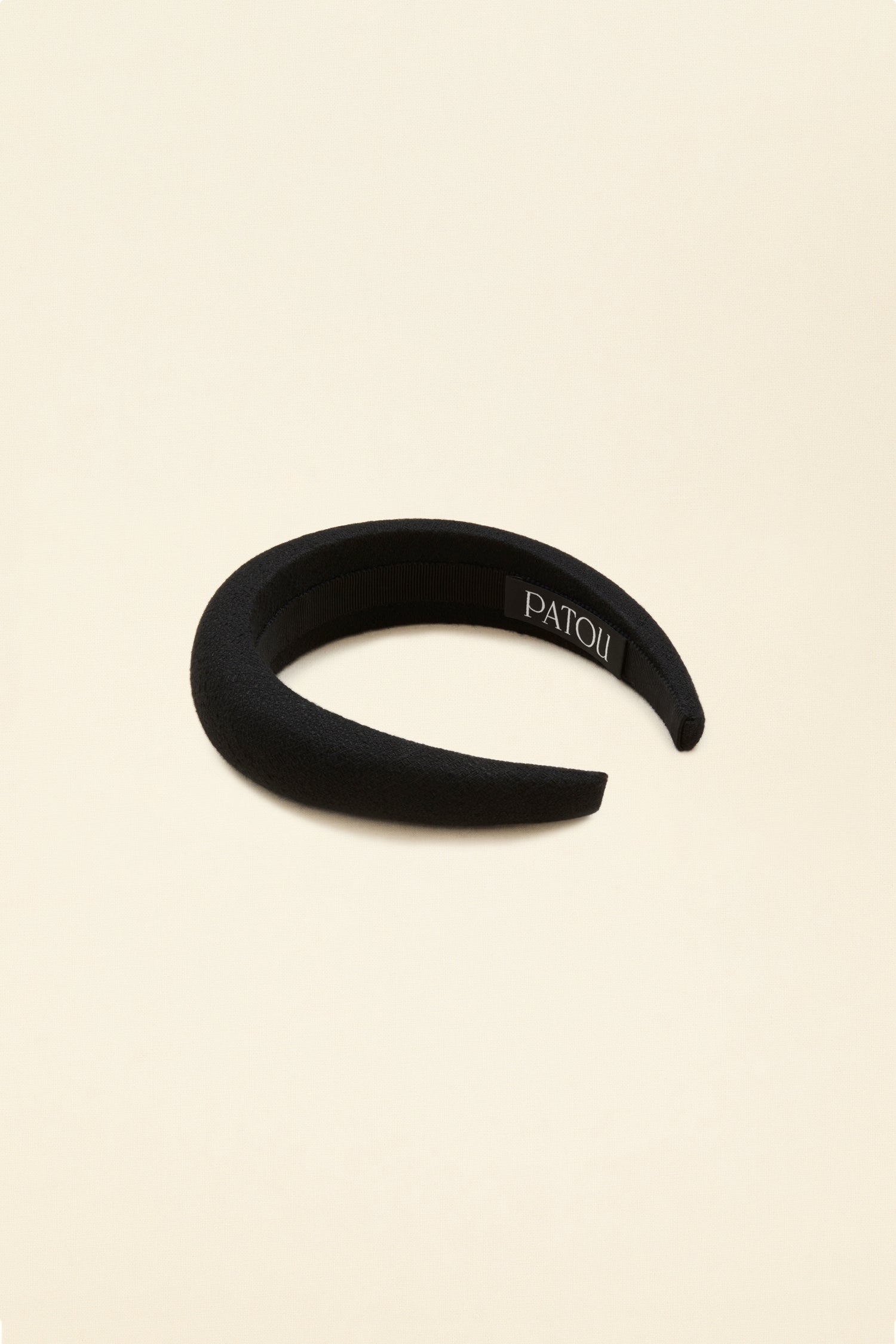 Patou - Padded headband in organic tweed - Black - A fetching tweed crown fit for modern-day royalty.Black cotton and wool blend tweed headband. Thick padded style. Gold-coloured JP logo. Grosgrain-lined underside with embroidered Patou label.
