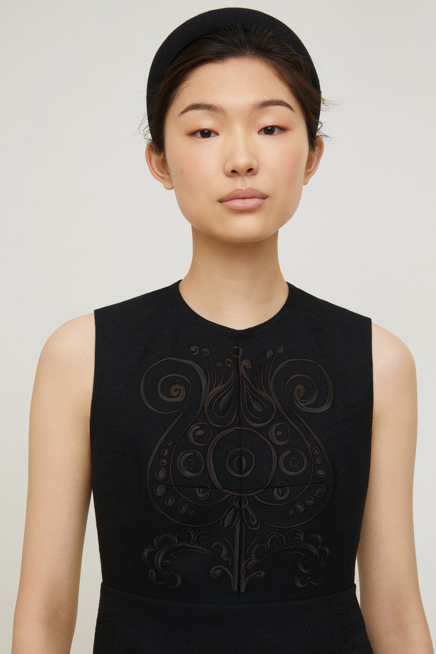 Patou - Embroidered mini dress in organic tweed - Black - Embroidery, the Patou way to tell a story.Black cotton and wool tweed mini dress. Floral embroideries inspired by Fantasia Botanica’s signature print; two-tone thread to provide extra depth. Sleeveless style with fitted bodice. Zip fastening and signature curved seam the back.Flared skirt with pockets at the sides and darts at the back.