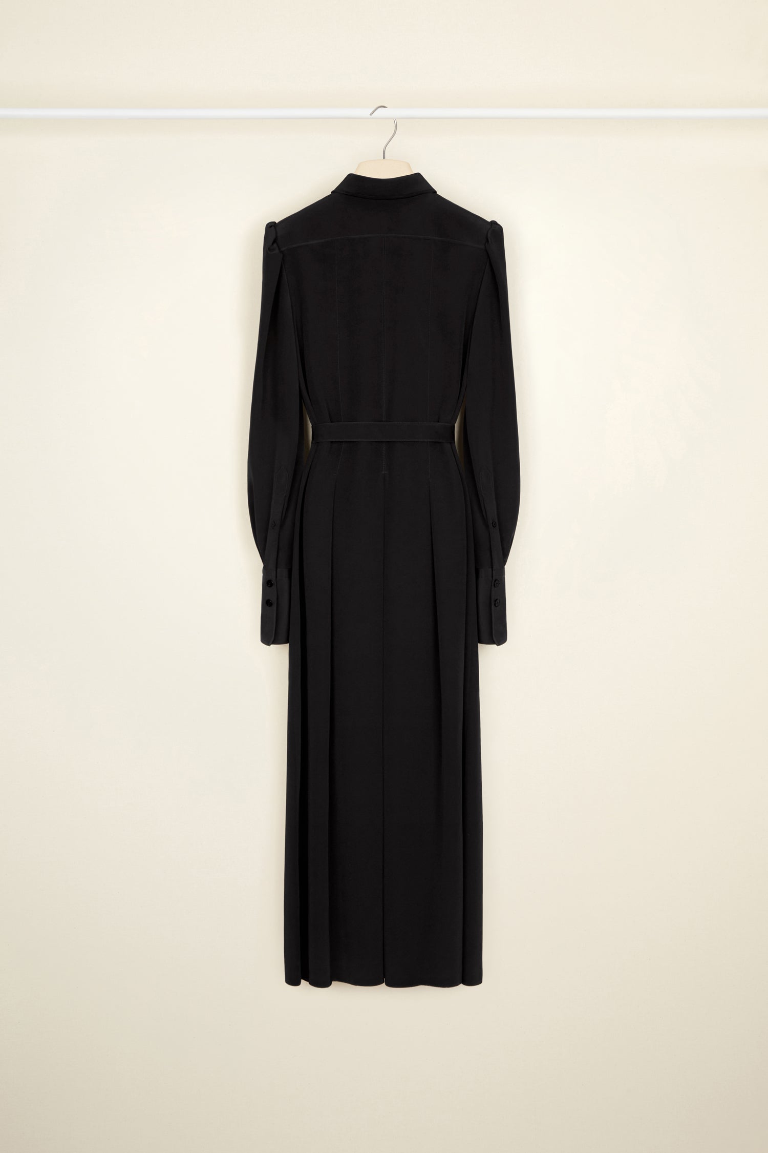 Patou - Pleated silk midi shirt dress - Black - Elongated and pleated, the shirt reinvented. Black silk crepe midi dress. Shirt-inspired silhouette with button fastening down the bodice. Puffed shoulders. Wide buttoned cuffs. Belted at the waist. Pleated skirt.