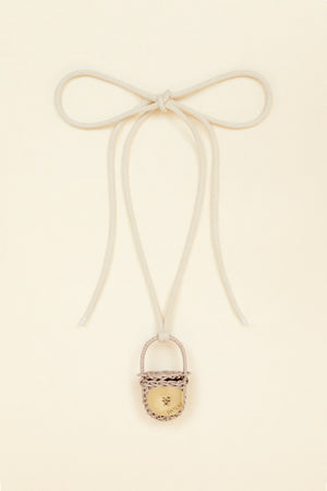 Bucket bag necklace in wicker