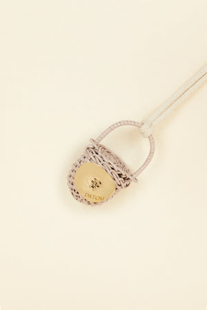Bucket bag necklace in wicker