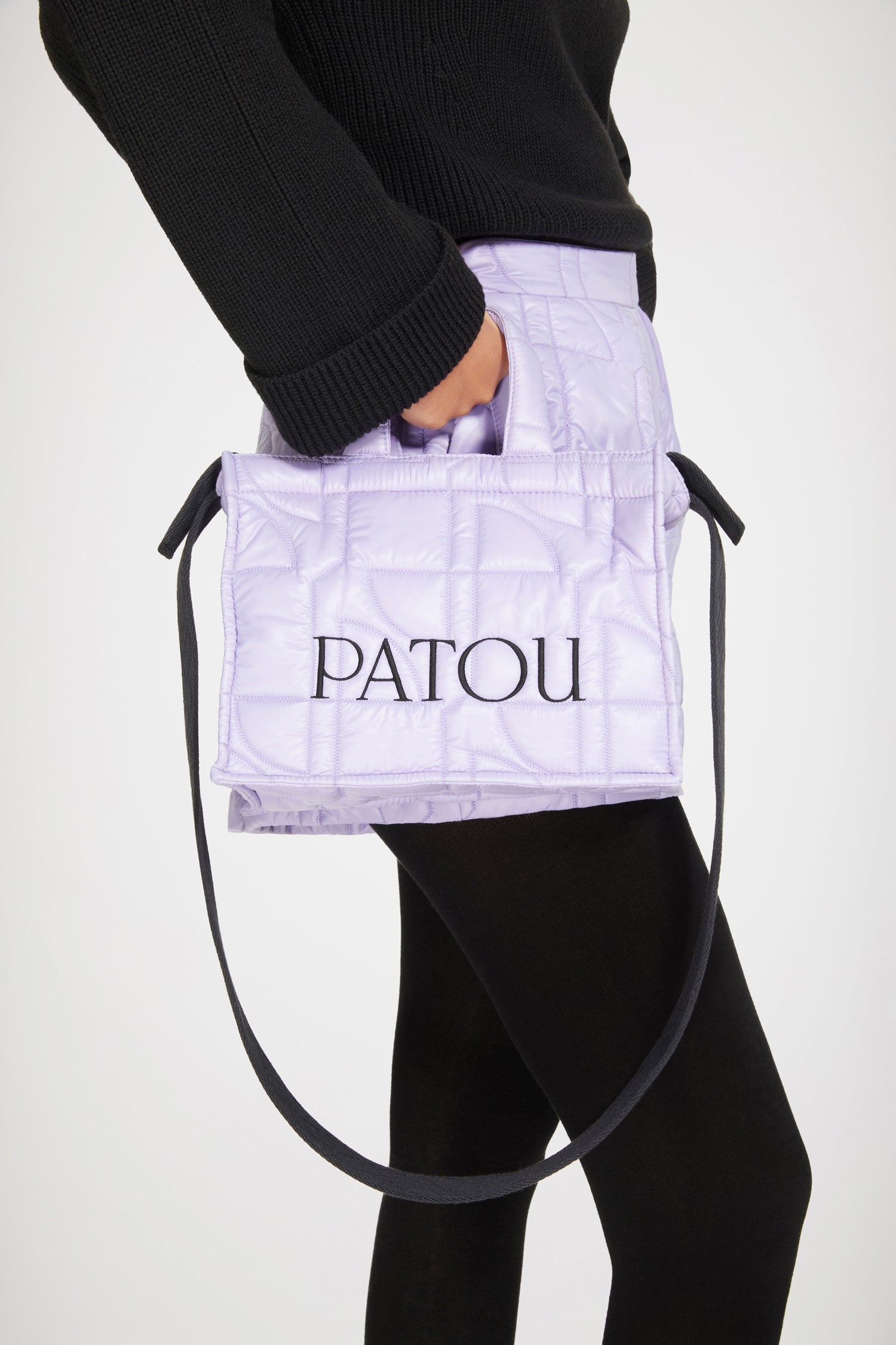 Patou - Small Patou quilted tote - Lavender - Carry your Patou everywhere with you. Lavender recycled polyamide tote. JP quilting all over. Patou lettering logo in black. Black embossed shoulder strap attached via Patou-engraved gold buttons on both sides. Two top handles. Can be carried by hand or on the shoulder.