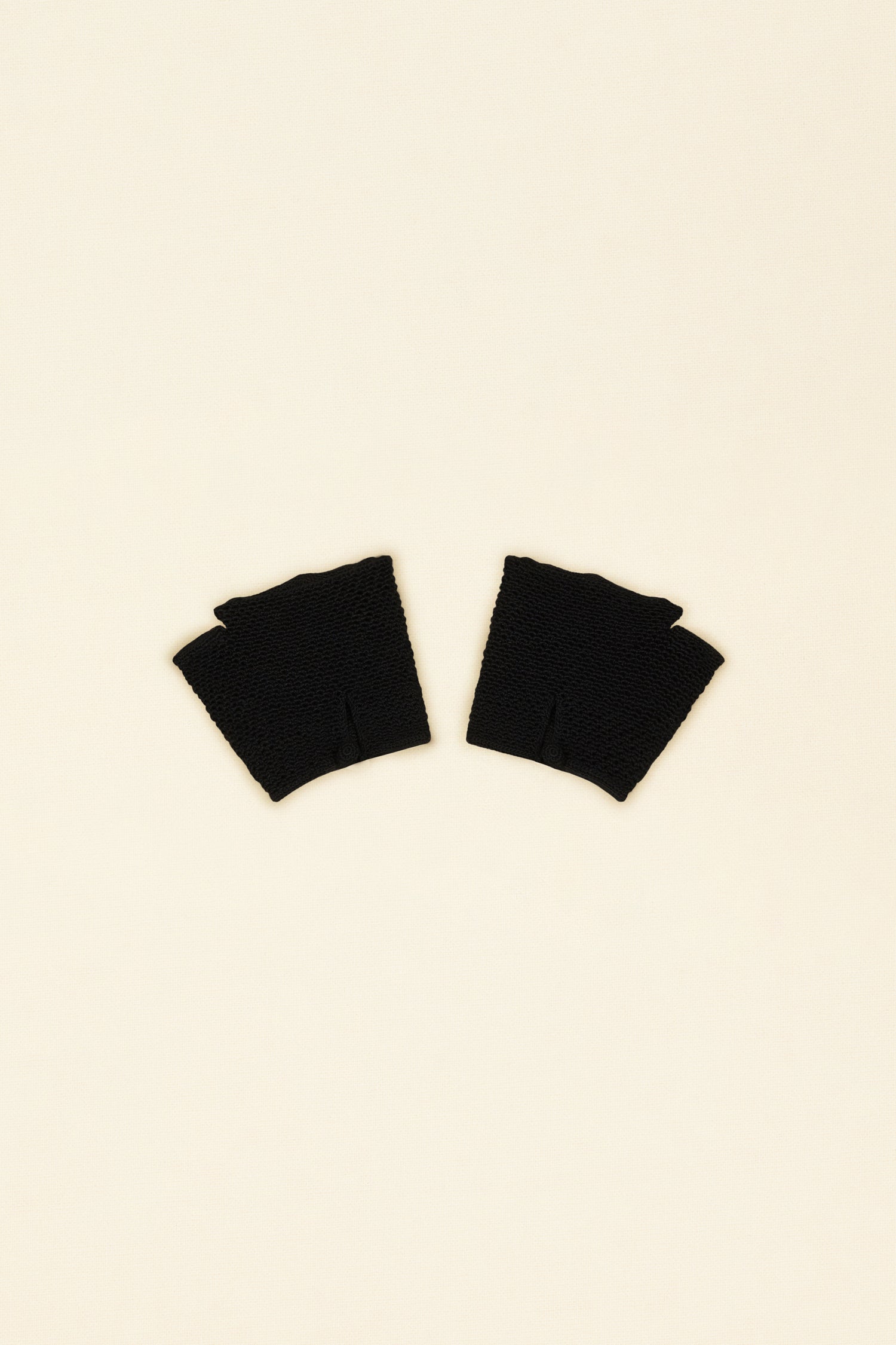 Patou - JP fingerless gloves in organic cotton - Black - Fingerless and fanciful, the Patou gloves are oh-so-wonderful!Black organic cotton fingerless gloves. Openwork detailing all over. JP monogram embroidered across the top. Crochet button.