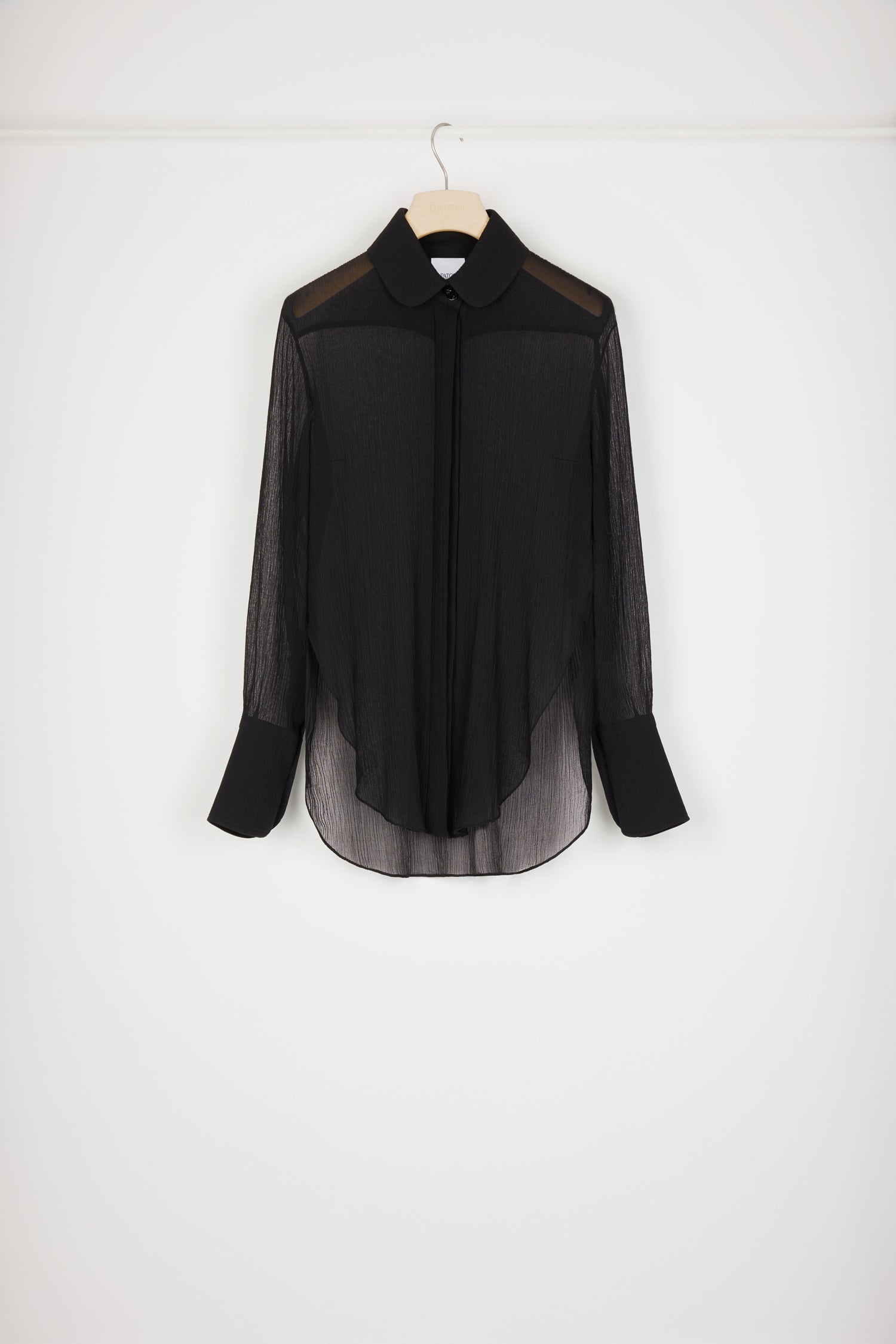 Patou - Sheer shirt in organic cotton - Black - Patou's new shirt is a sheer sensation.Black organic cotton shirt. Lightweight crepe texture that is slightly sheer. Peter Pan collar. Concealed button placket. Buttoned cuffs. Signature curved seam at the back.