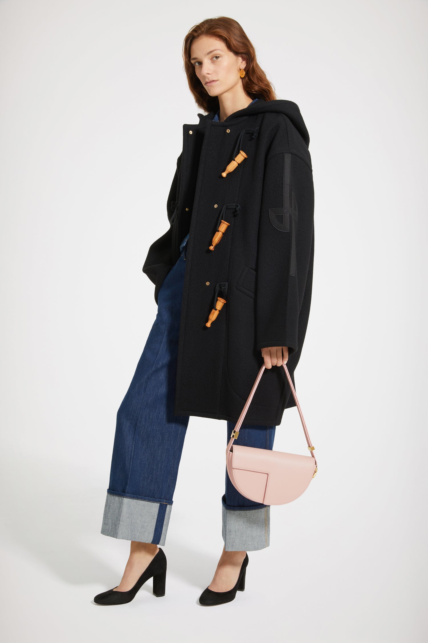 Patou - Cashmere and wool blend duffle coat - Black - Wool and whistles.Black cashmere and wool duffle coat. Crafted from recycled materials blended to achieve a softly worn look over time. Oversized silhouette. Hooded collar. Fastens via wooden buttons shaped like bird calls as well as concealed press buttons. Stylised JP logo embroidered in black on the left sleeve. Oversized patch pockets.